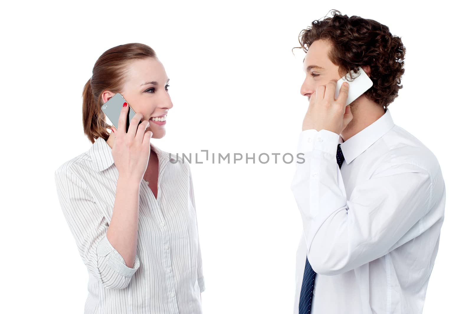 Office executives engaged over a phone call by stockyimages