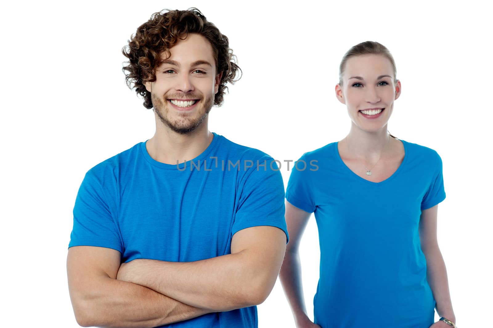 Smiling young couple in casuals by stockyimages