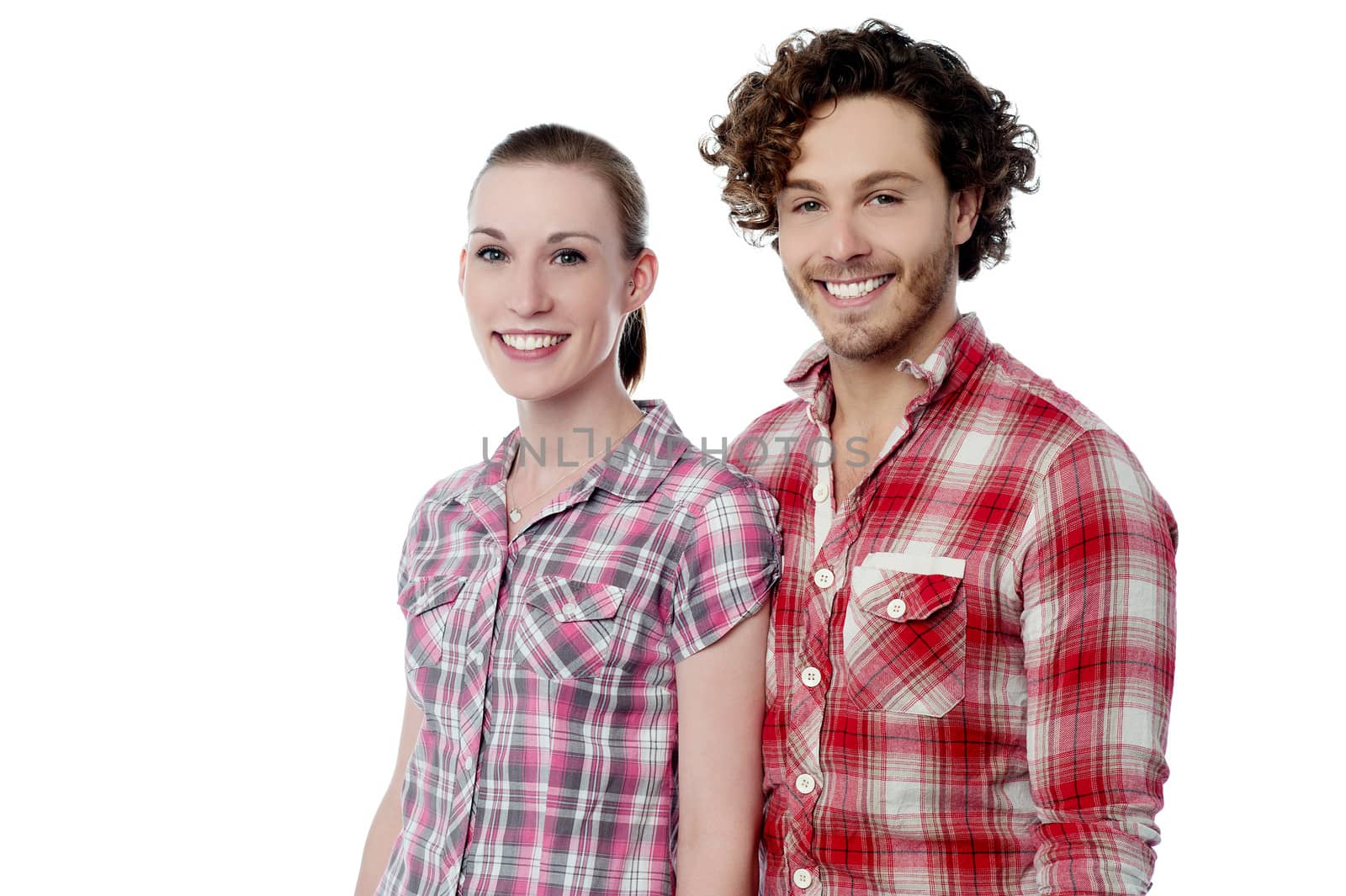 Young couple wearing stylish shirts by stockyimages