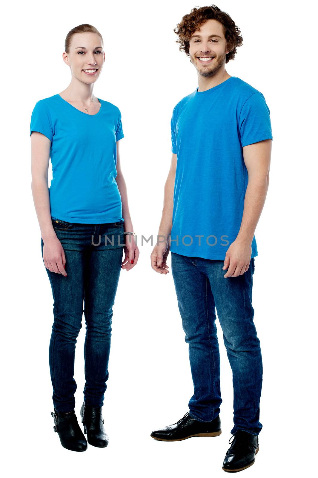 Perfect young couple posing in trendy casuals by stockyimages