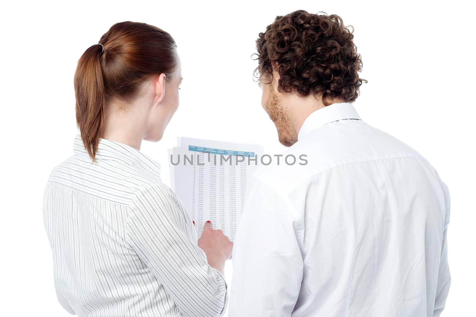 Business executives reviewing documents by stockyimages