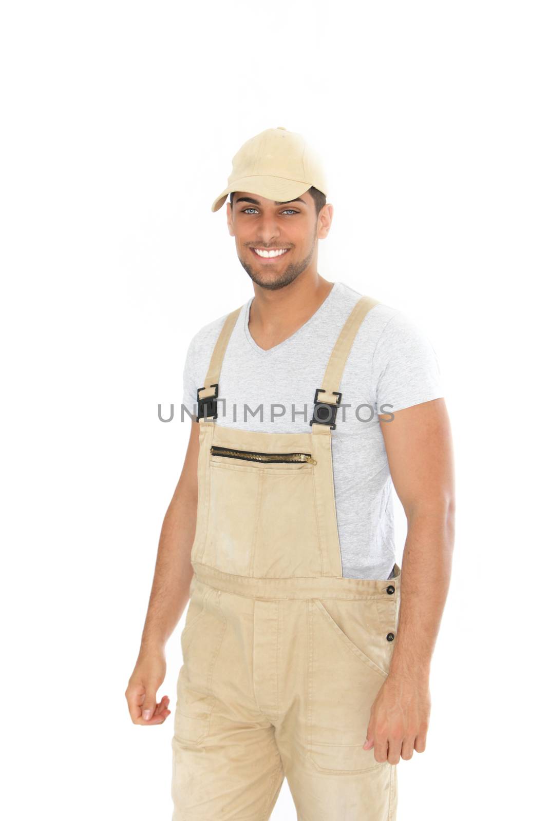 Smiling handsome man in dungarees and cap by Farina6000
