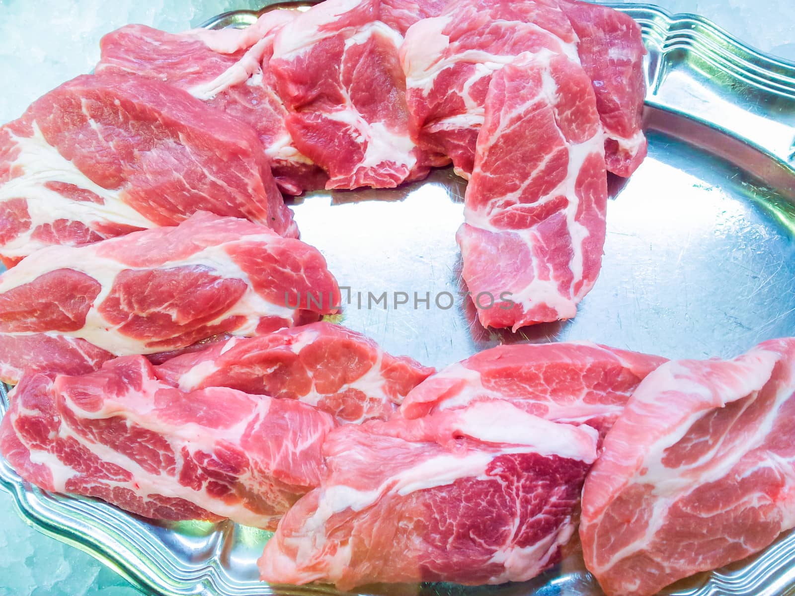 Fresh entrecote steaks prepared on silver tray