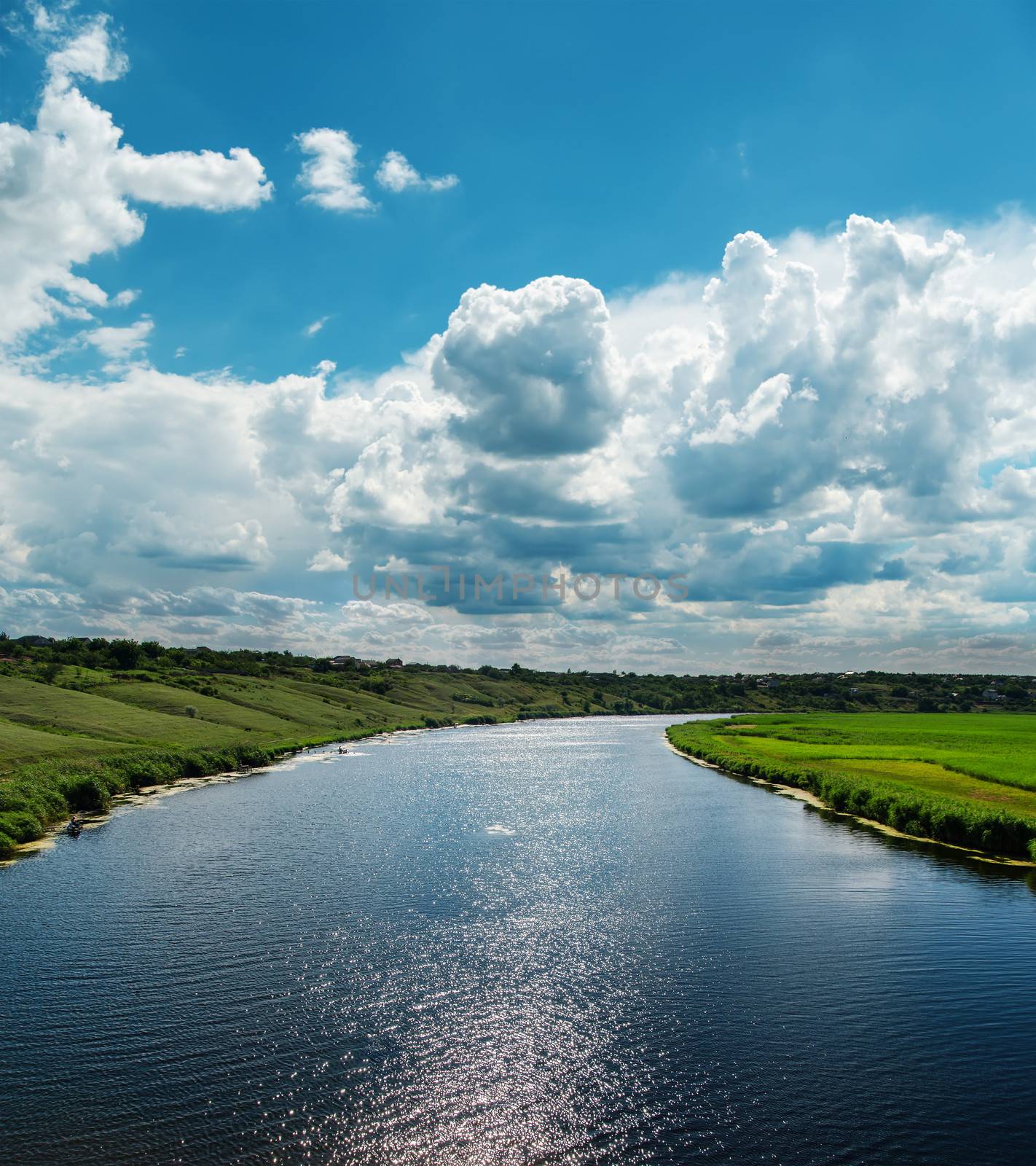 river with reflections of cloudy sky by mycola