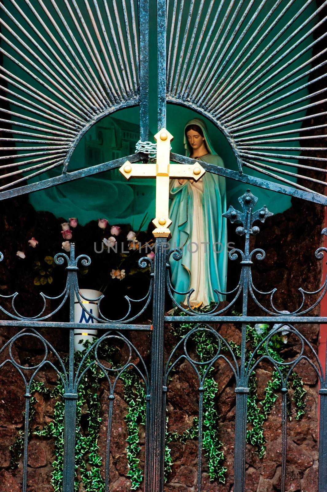 Cross at the gate of the Catholic Church