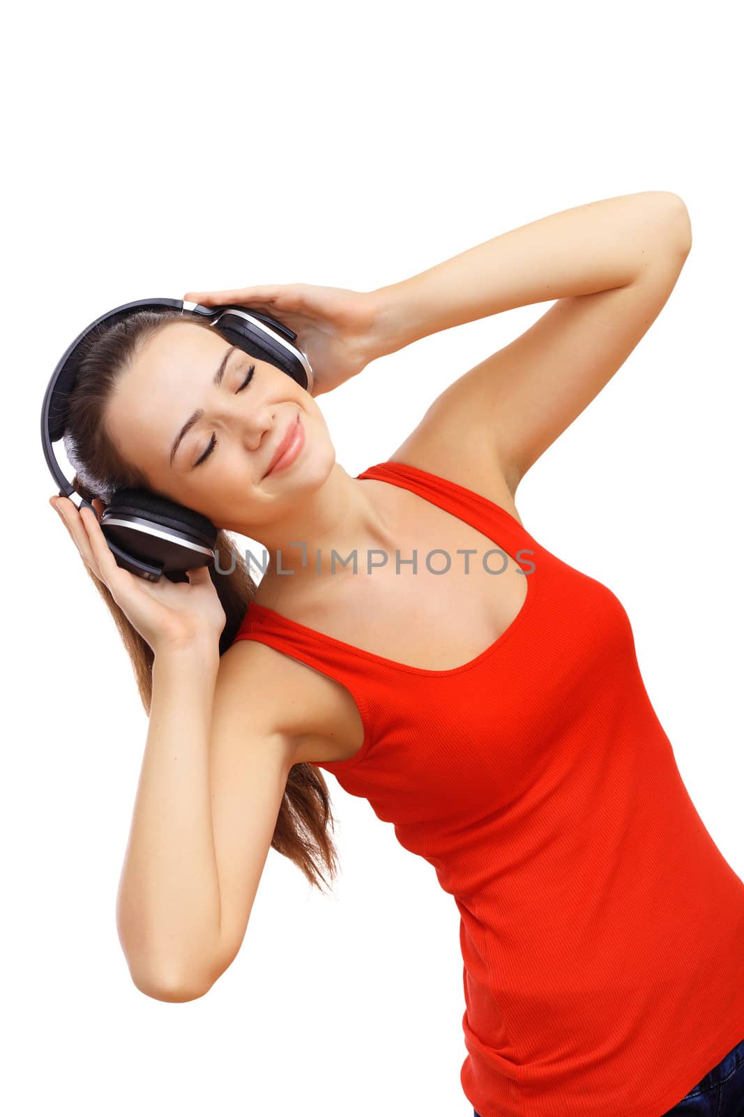 Happy smiling girl dancing and listening to music