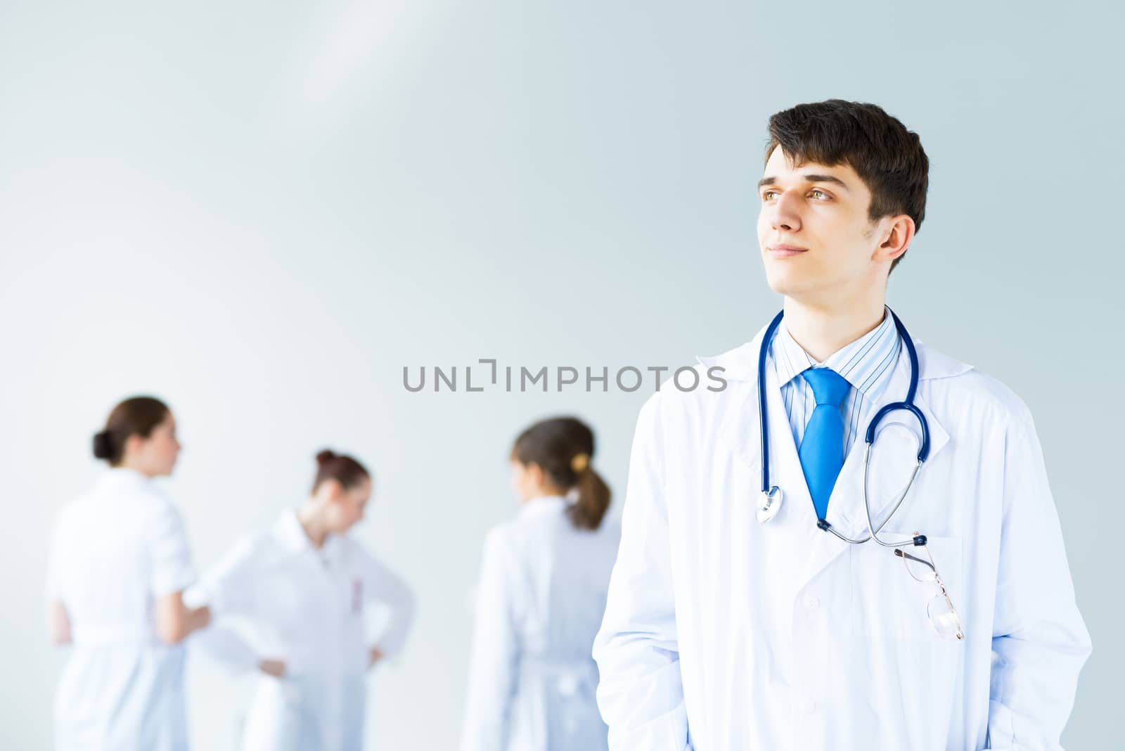 portrait of successful young doctor by adam121