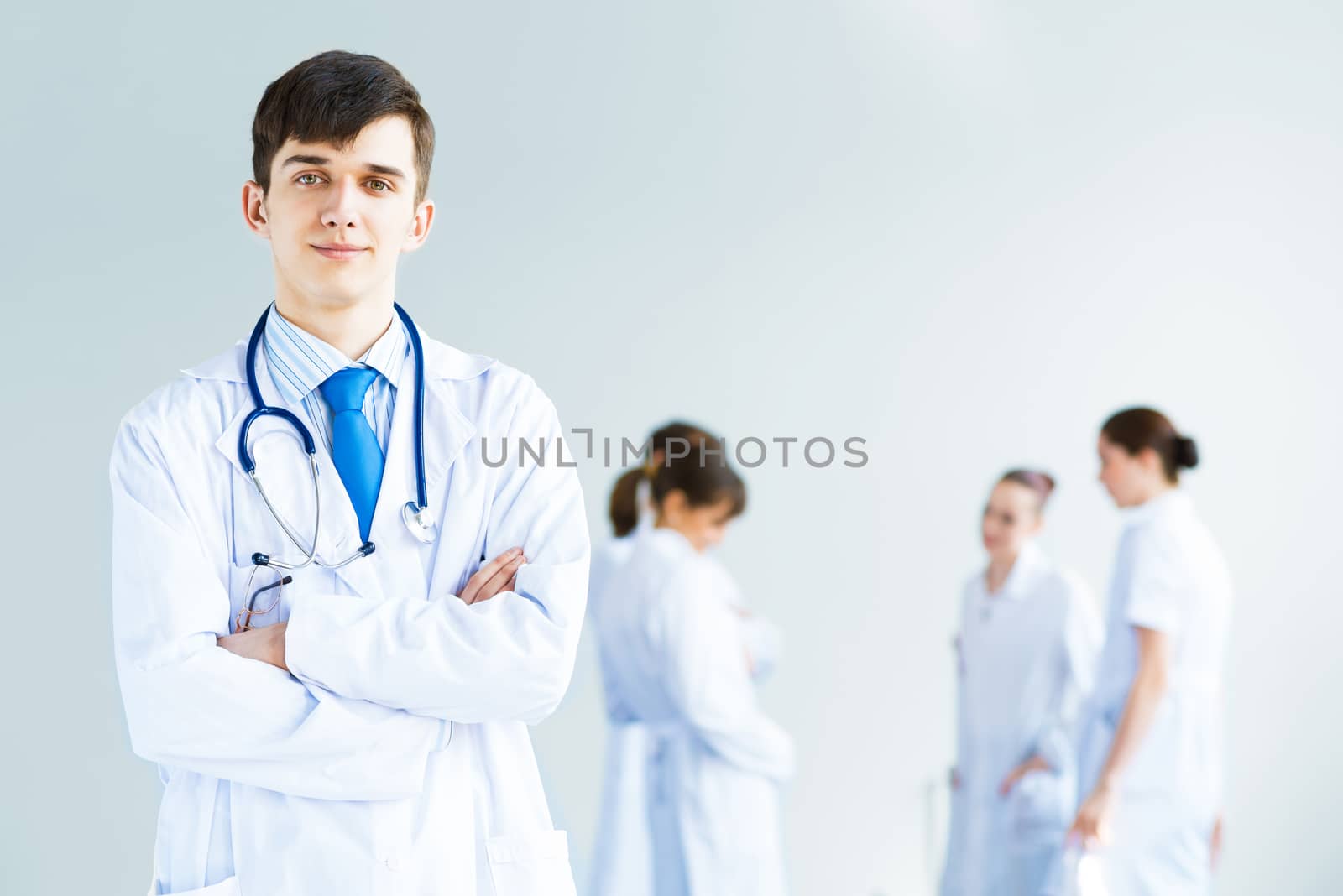 portrait of successful young doctor by adam121