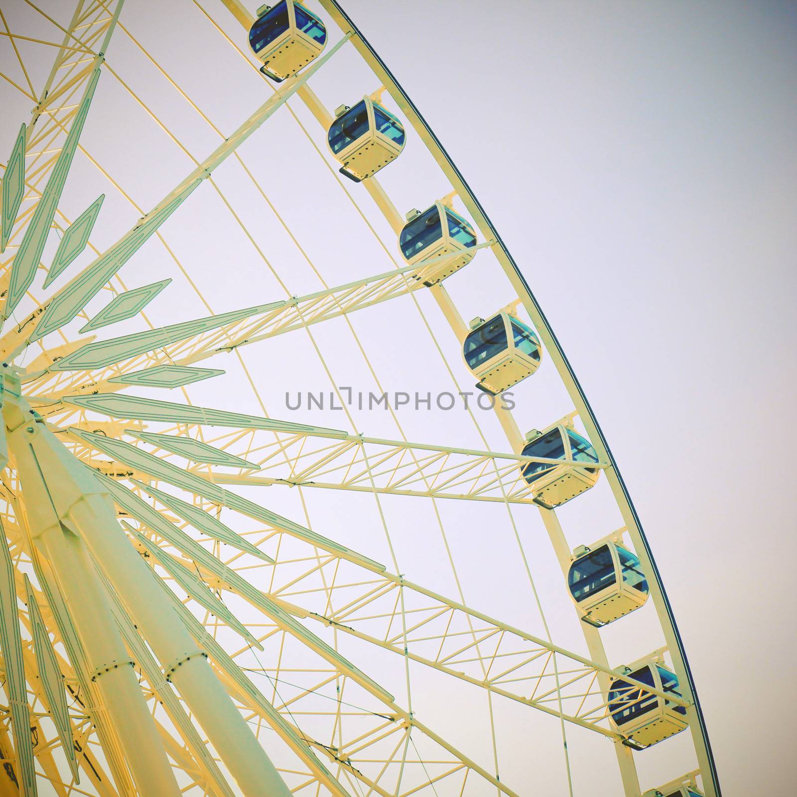 Ferris wheel with blue sky with retro effect by nuchylee