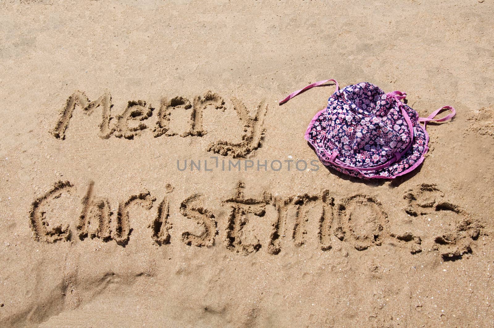 Merry Christmas written in the sand  by jelen80
