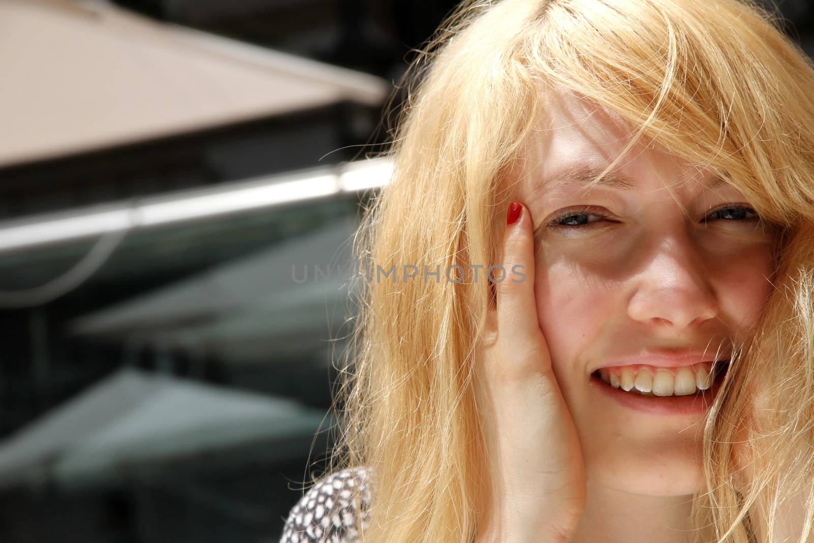 Smiling young woman in the sunlight	 by Spectral