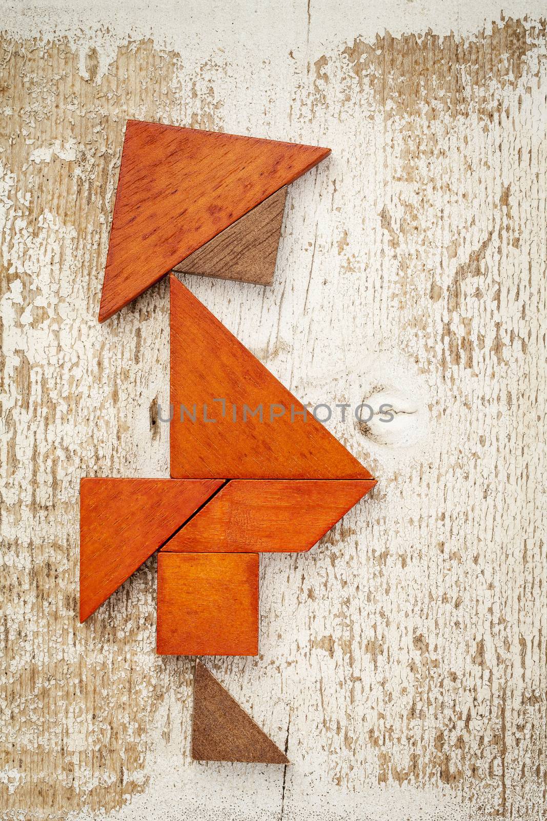 obesity concept - abstract figure of a fat man built from seven tangram wooden pieces, a traditional Chinese puzzle game,, rough white painted barn wood background