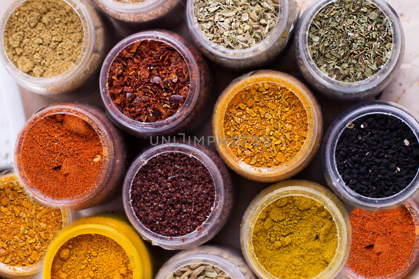 Different kind of assorted spices in containers