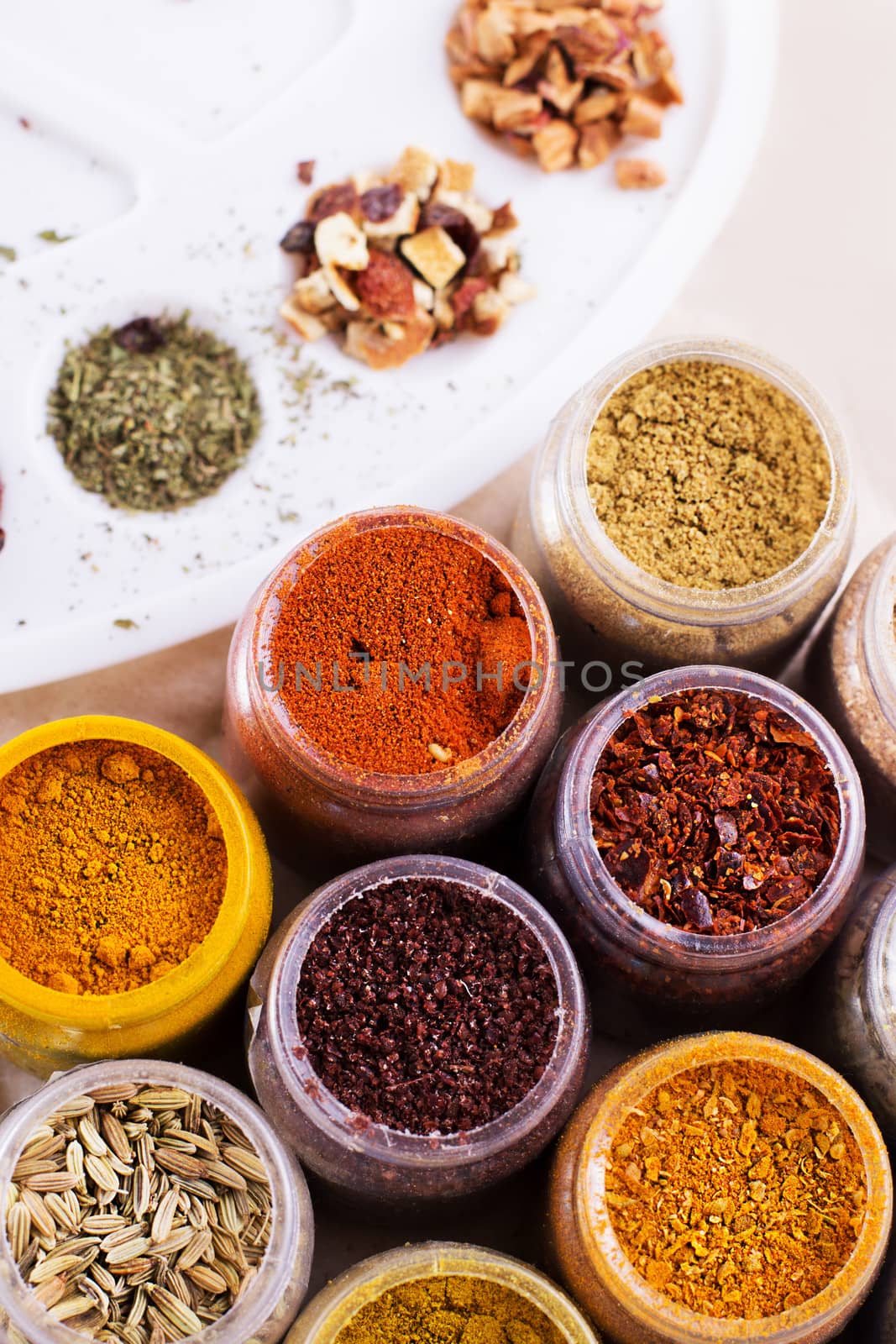 Assorted spices and dry tea in boxes by Angel_a