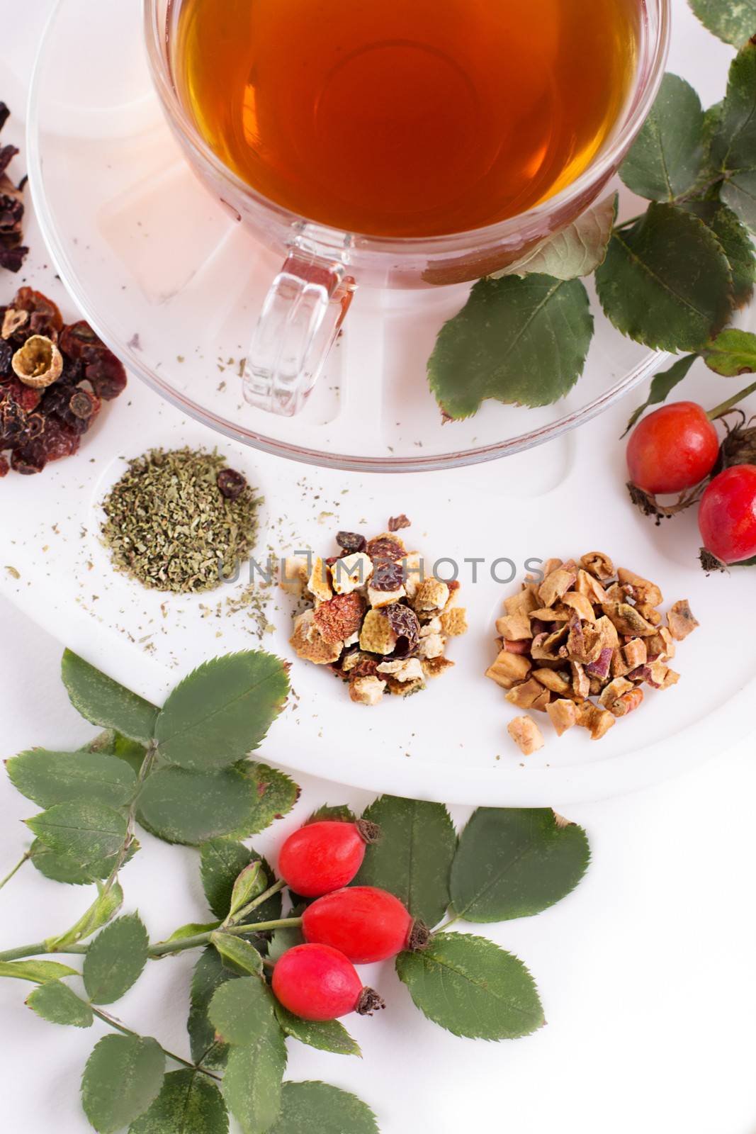 Assortment of dry tea in palette, isolated on white