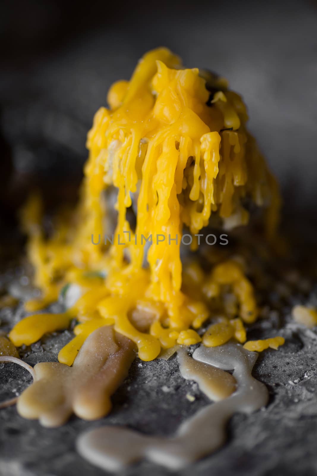 melted yellow candle