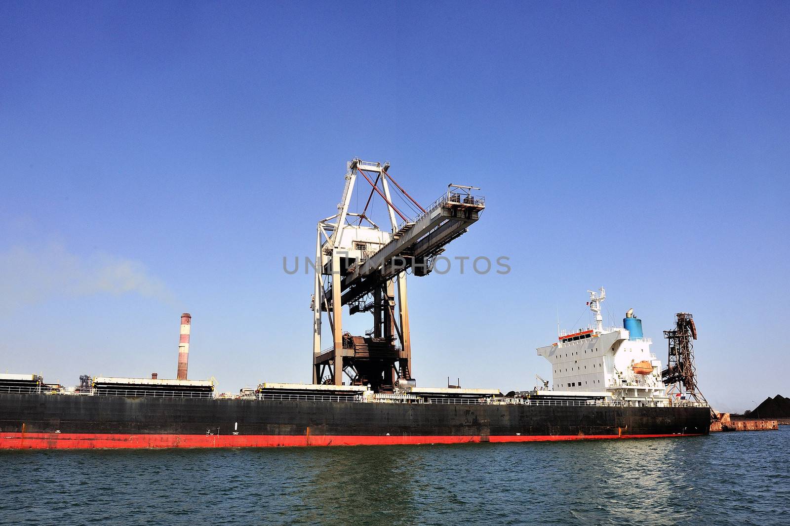 unloading of an ore cargo liner for the steel-works at Fos-sur-Mer beside Marseille.