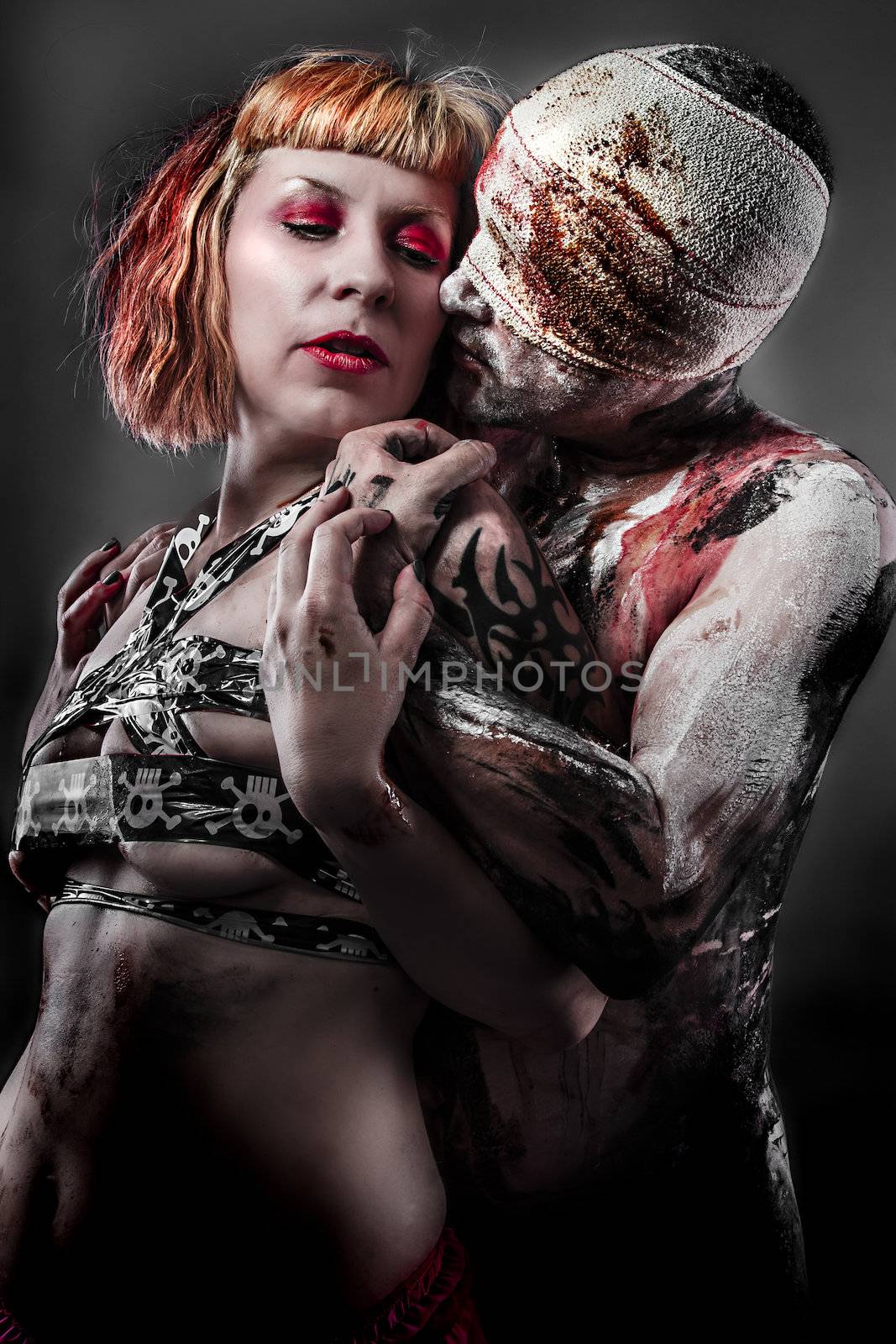 Violence concept, couple with wounds and bandages