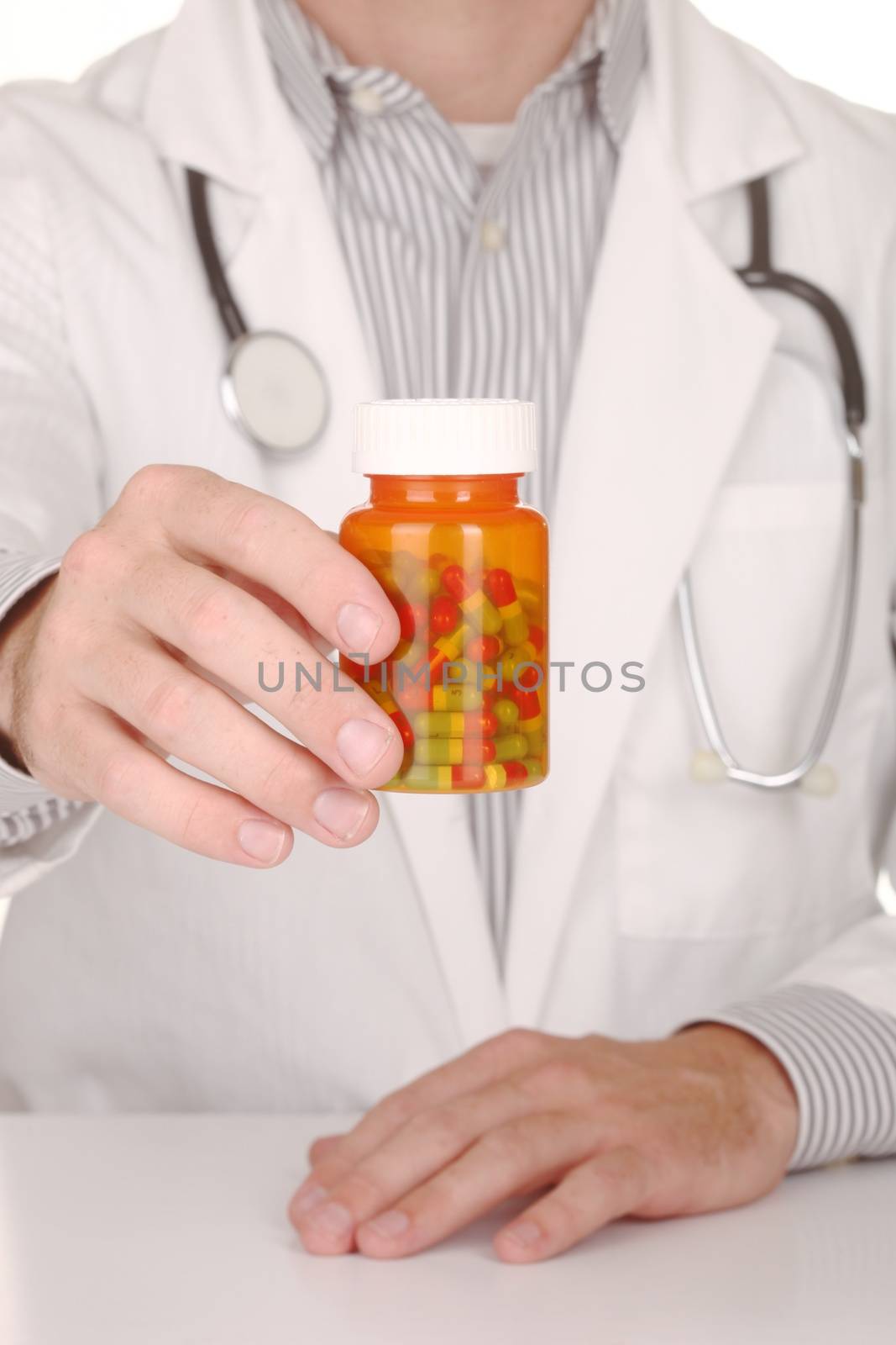 Doctor With Medication in Prescription Bottles by tobkatrina