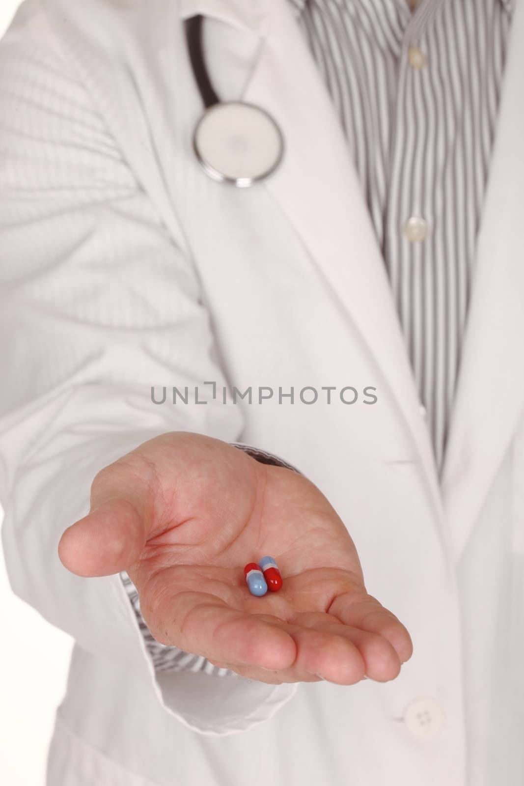 Caucasian Doctor With Medication in Hand Reaching Out by tobkatrina