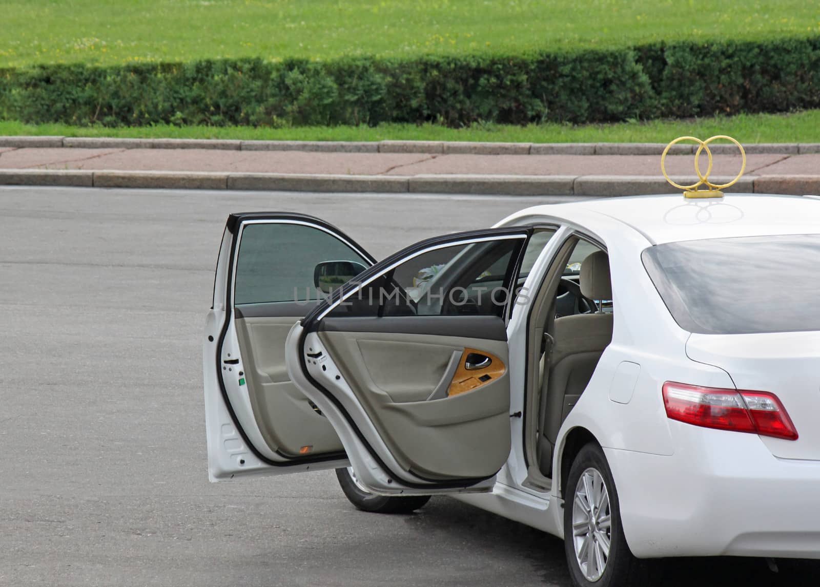 white wedding car with opened doors