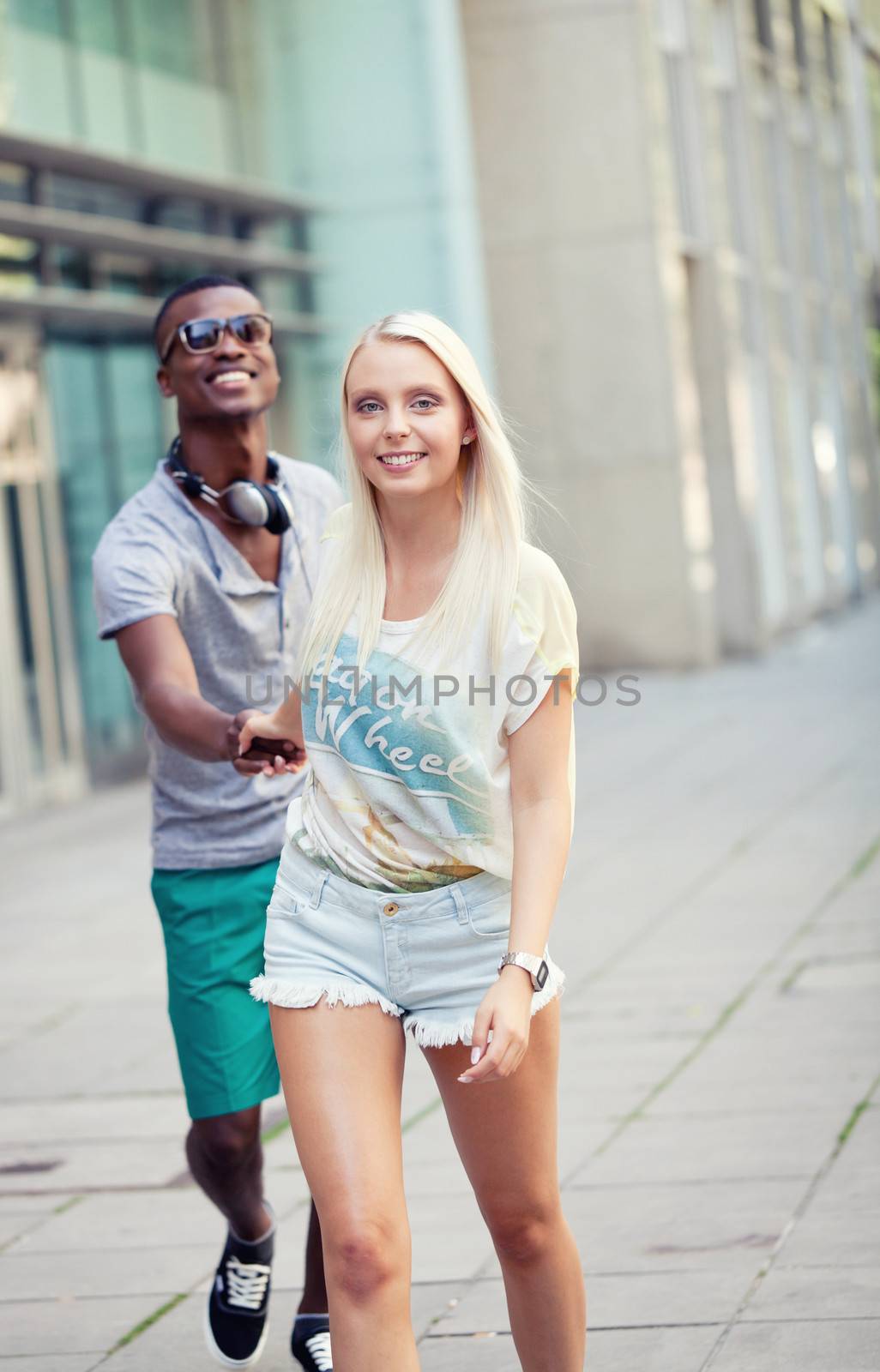 happy young couple have fun in the city summertime outdoor smiling lifestyle