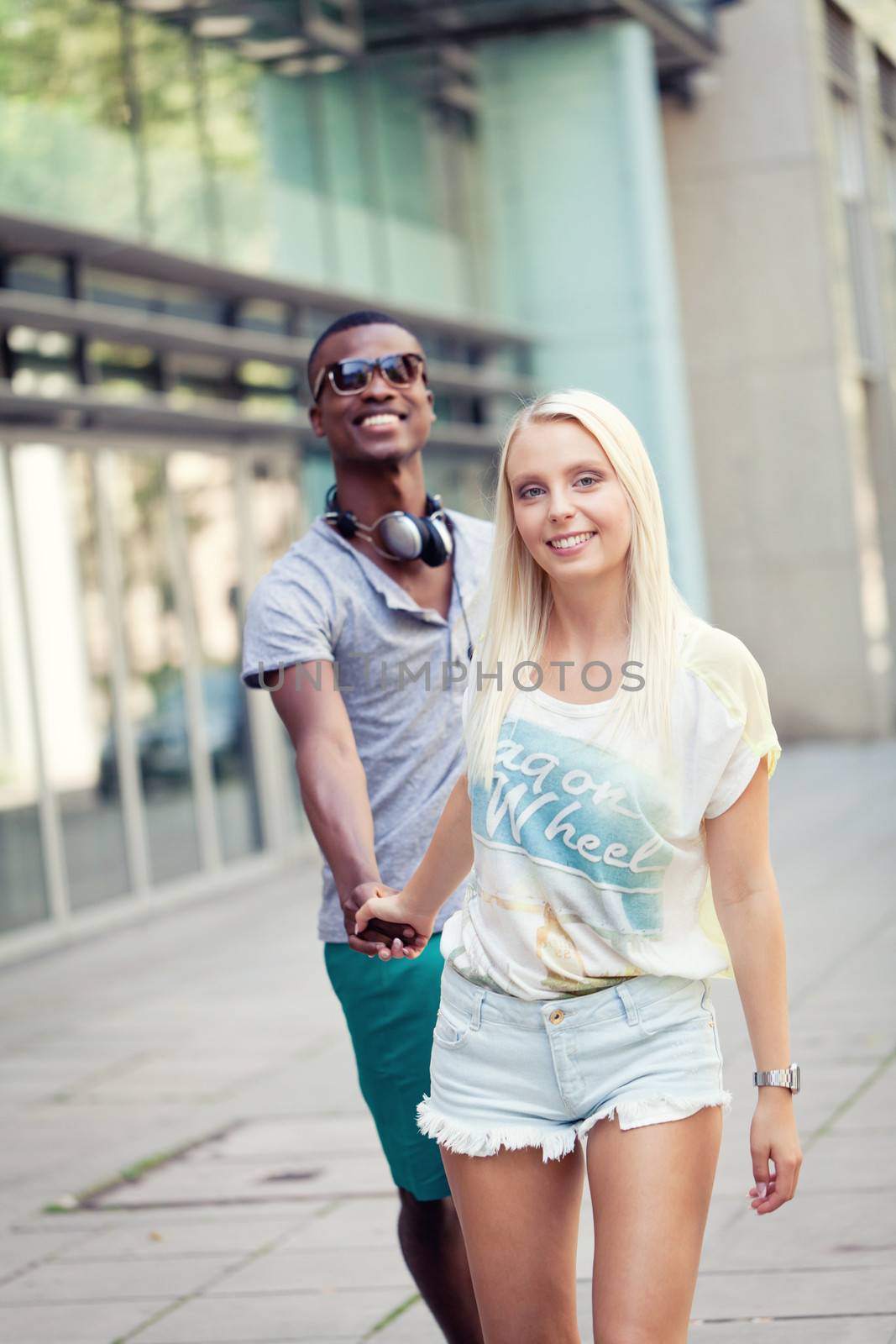 happy young couple have fun in the city summertime outdoor smiling lifestyle