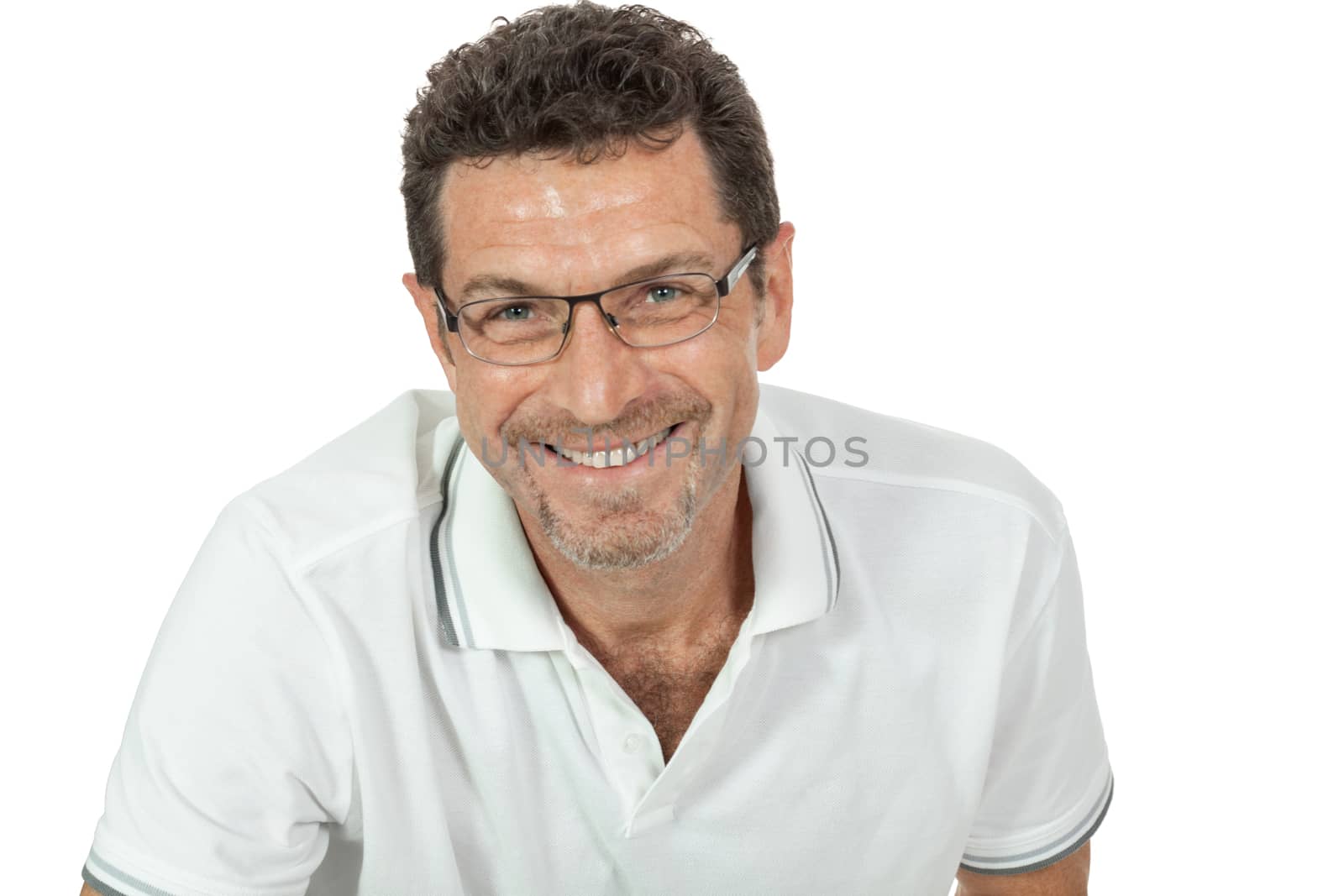 attractive healthy adult man sitting on floor with glasses and jeans t-shirt casual lifestyle isolated