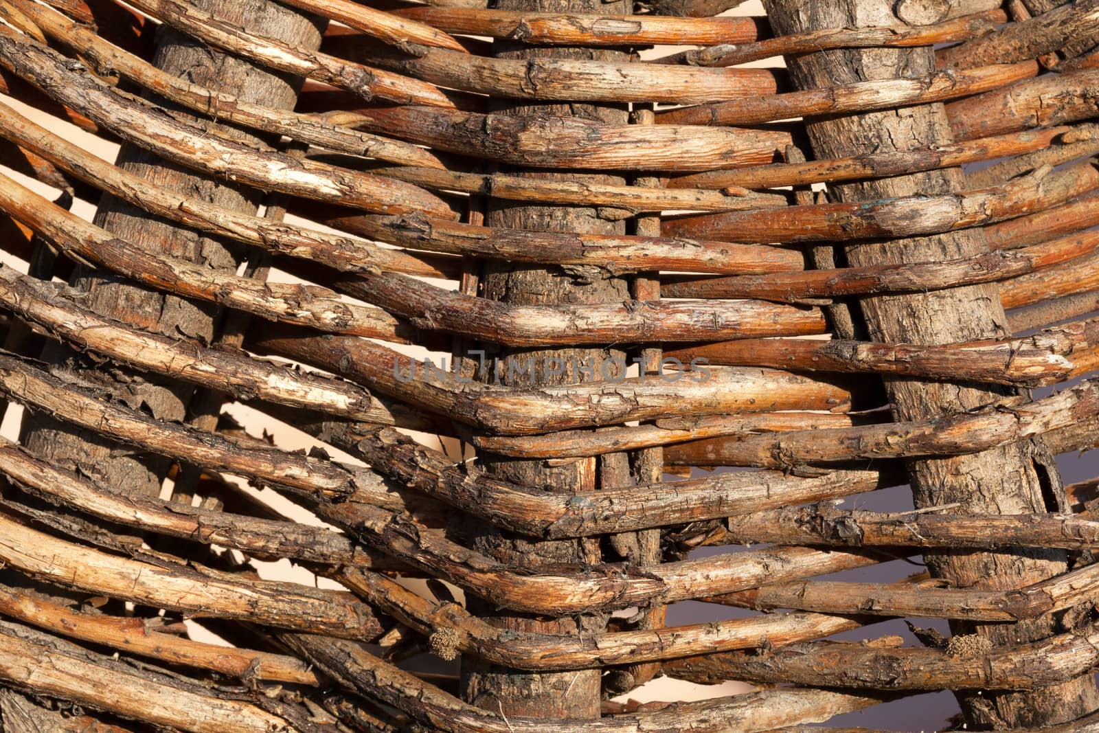 Texture of old wicker basket close-up in sunlight