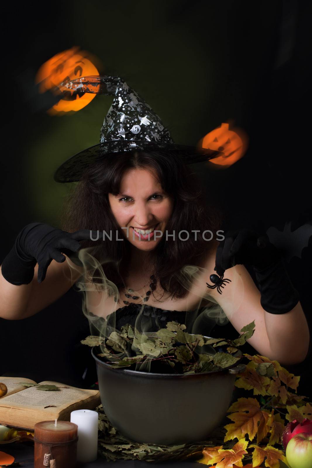 Witch making magic on Halloween night
