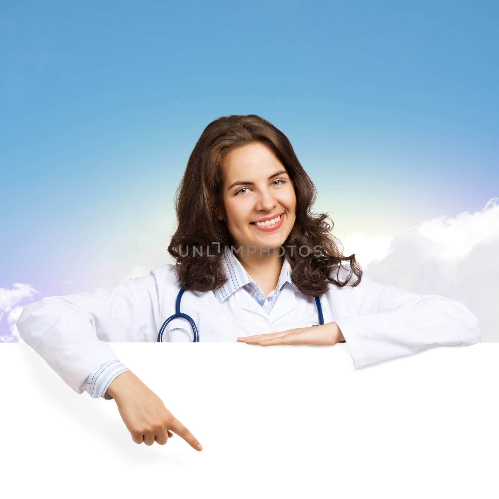 Young attractive female doctor put her hands on the blank banner, points at a place for text