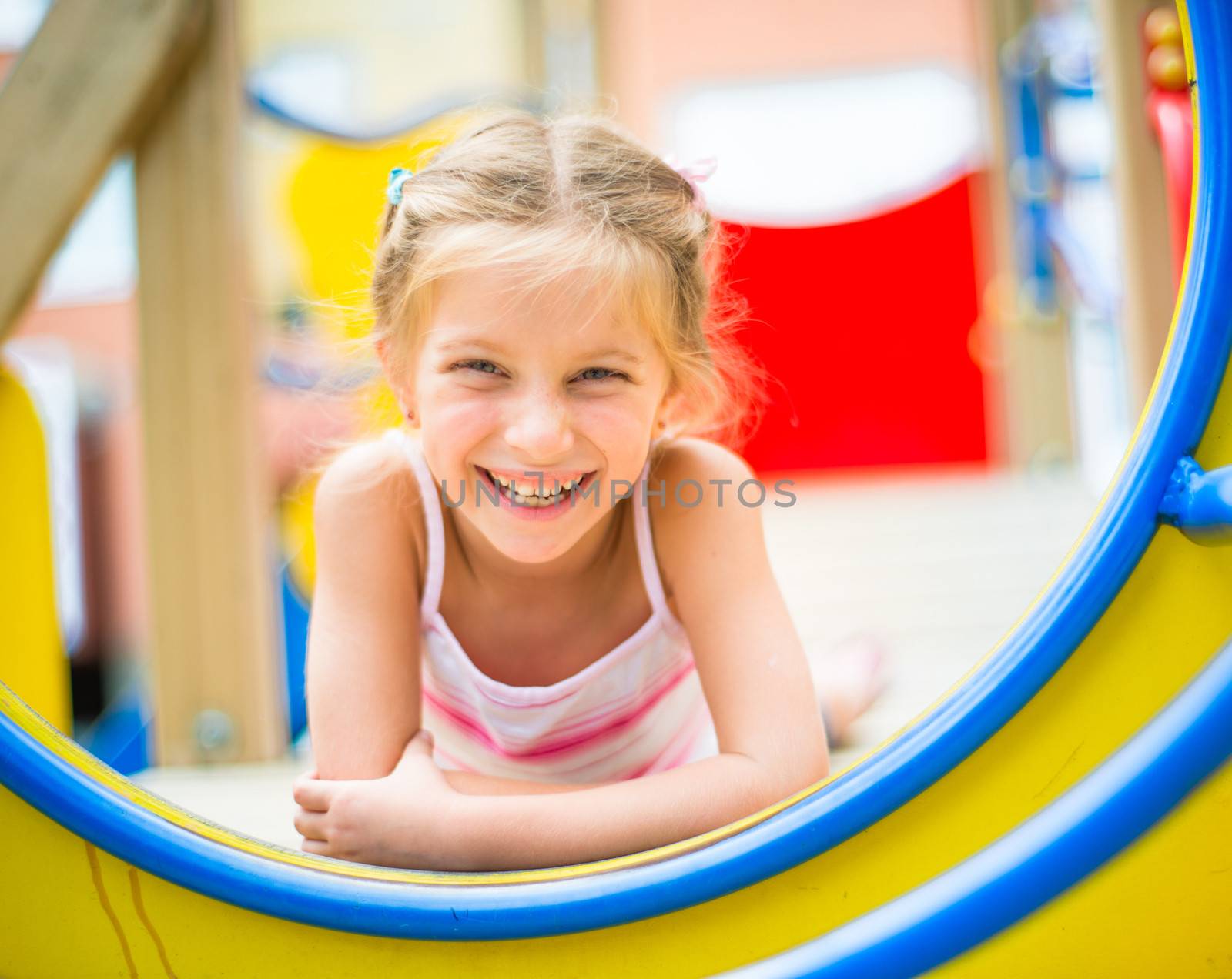 beautiful smiling girl on a playground