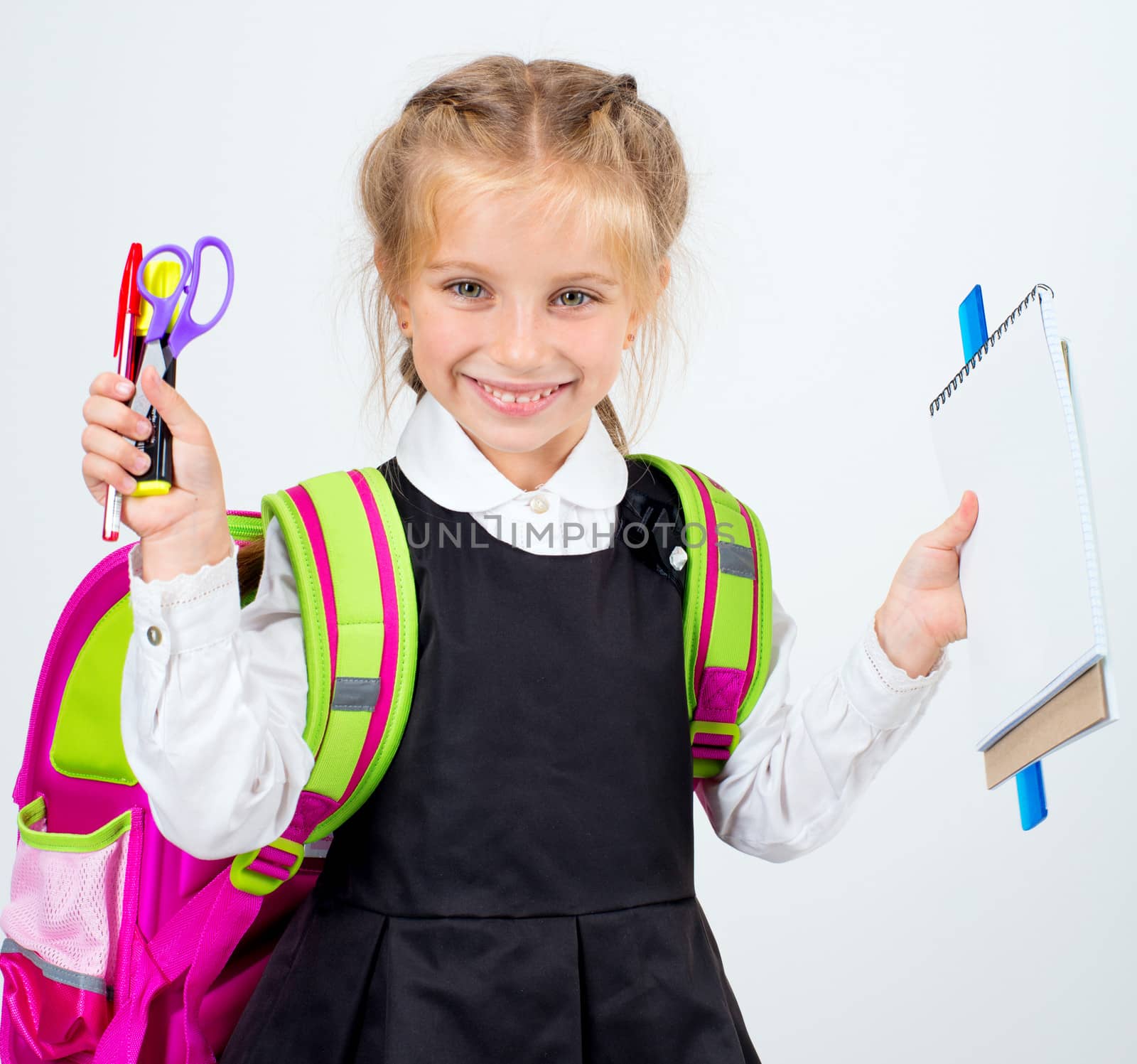 little laughing girl with a stationery on white