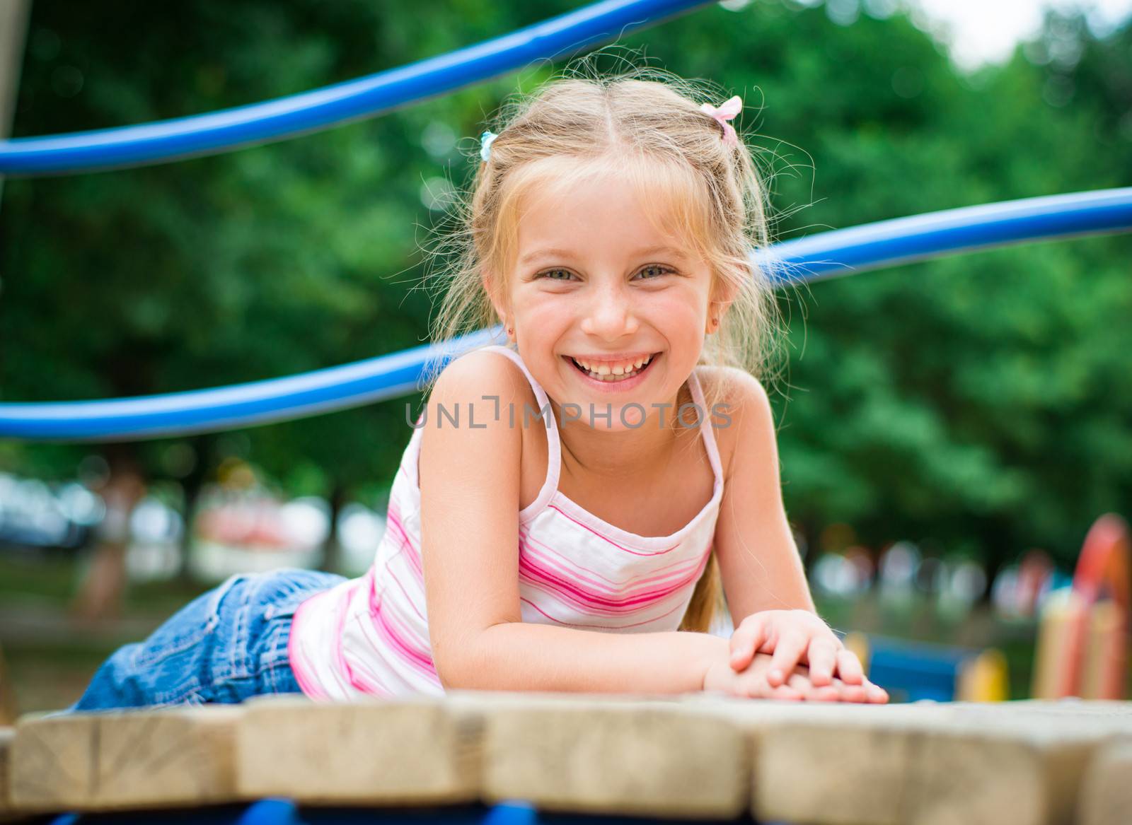 cute smiling little girl on a playground