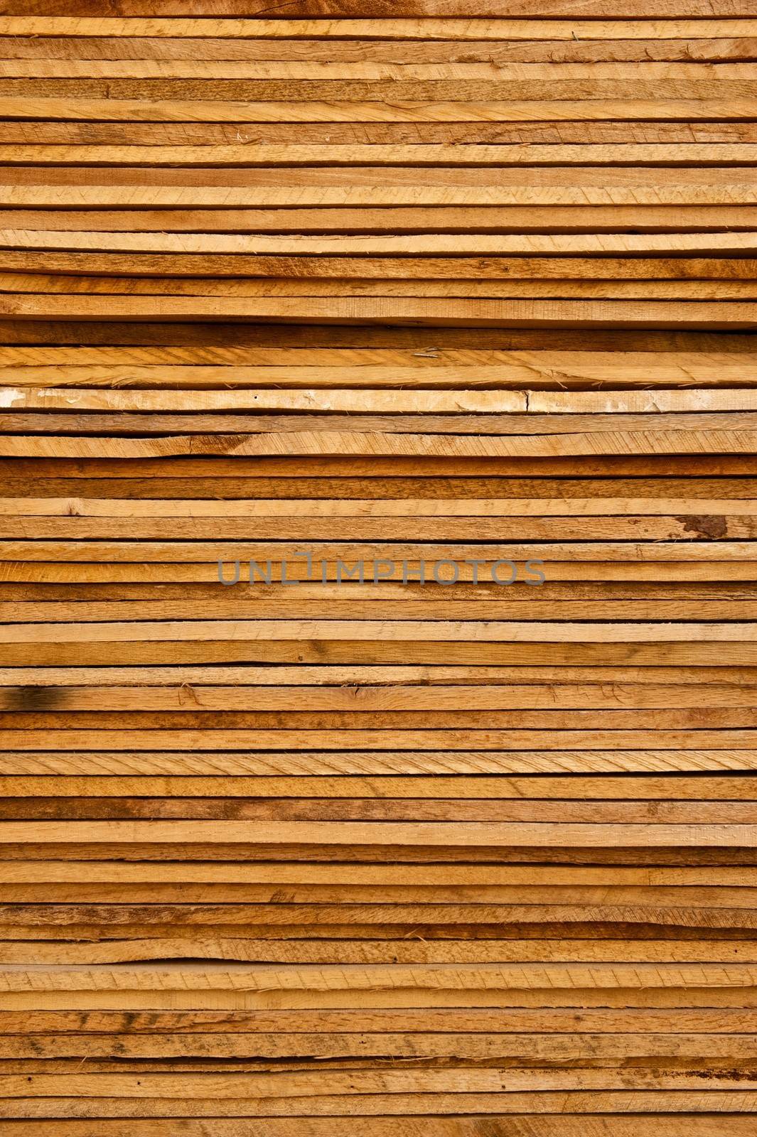Stack of Rough Cut Wood Lumber by pixelsnap
