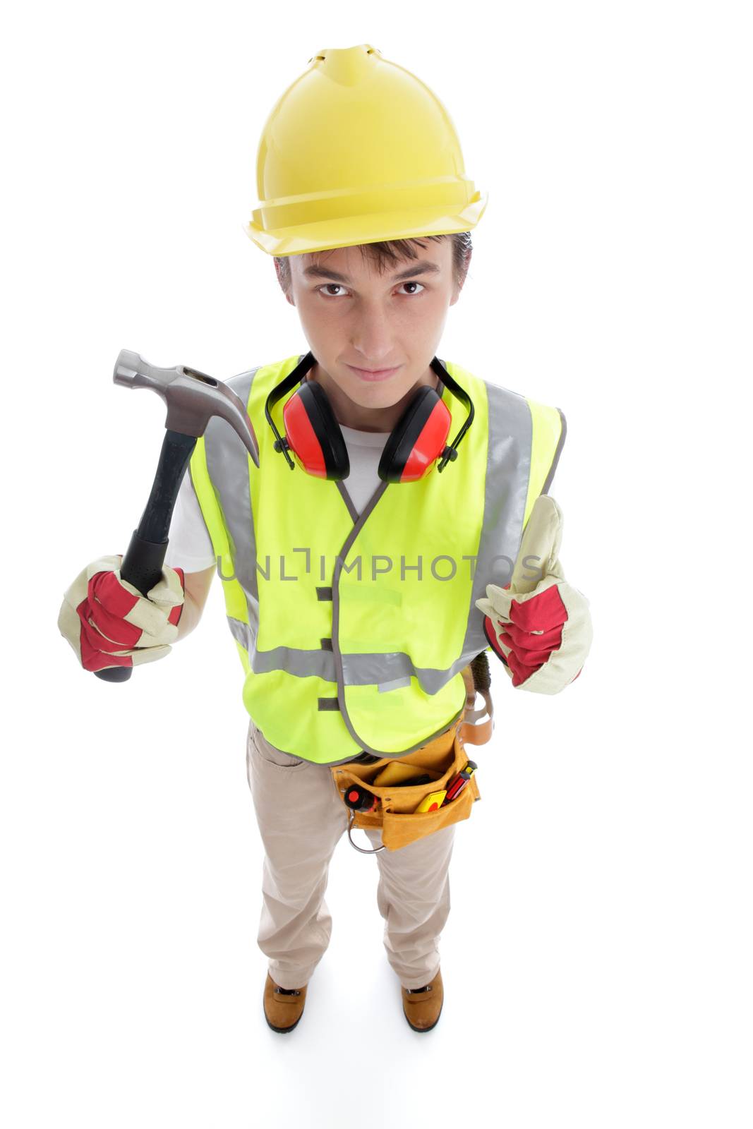Teenage apprentice builder or technical college tranee student holding a hammer and showing thumbs up approval success sign.  White background.