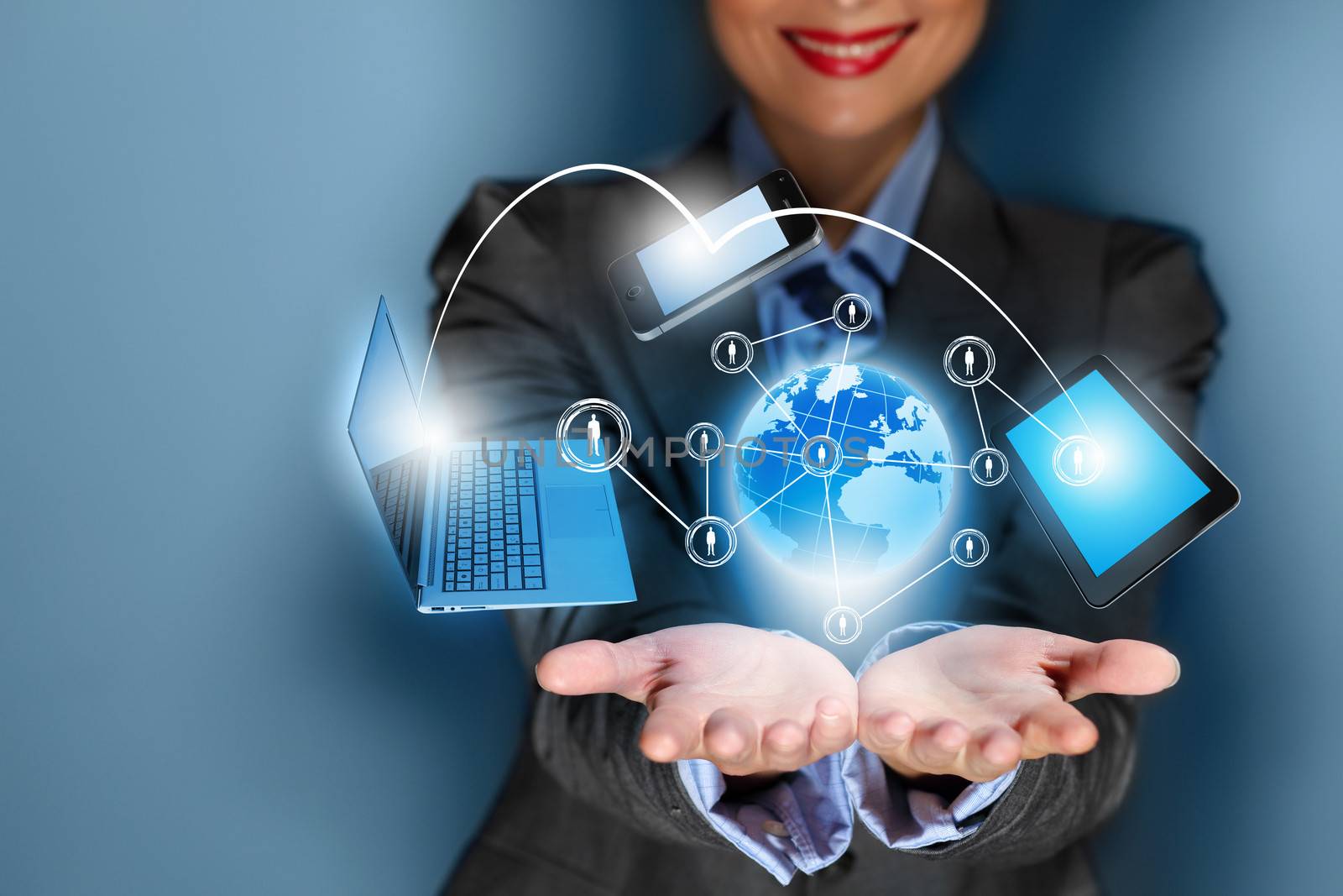 Close up image of businesswoman with 3d images of devices in her hands