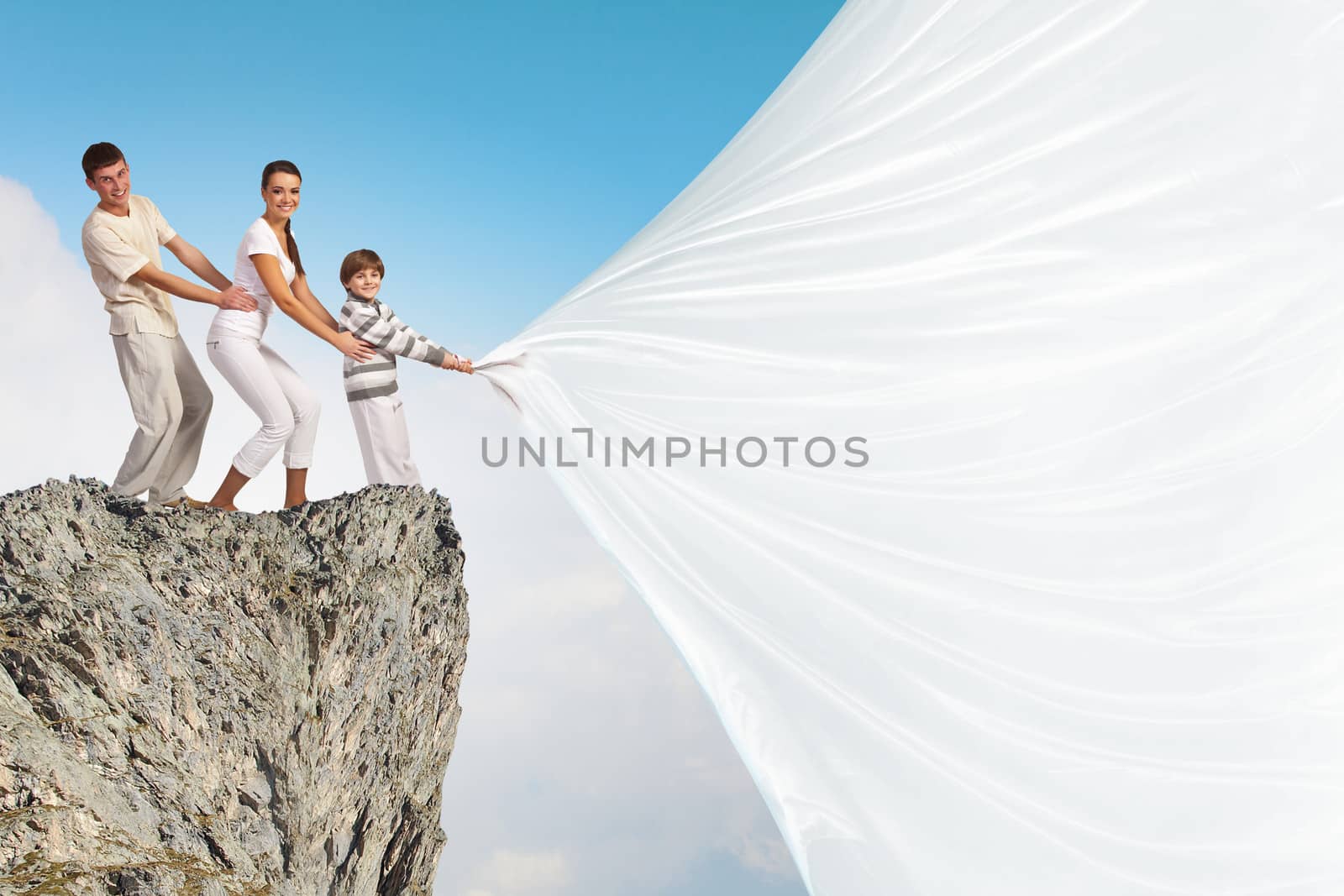 Young family pulling banner by sergey_nivens
