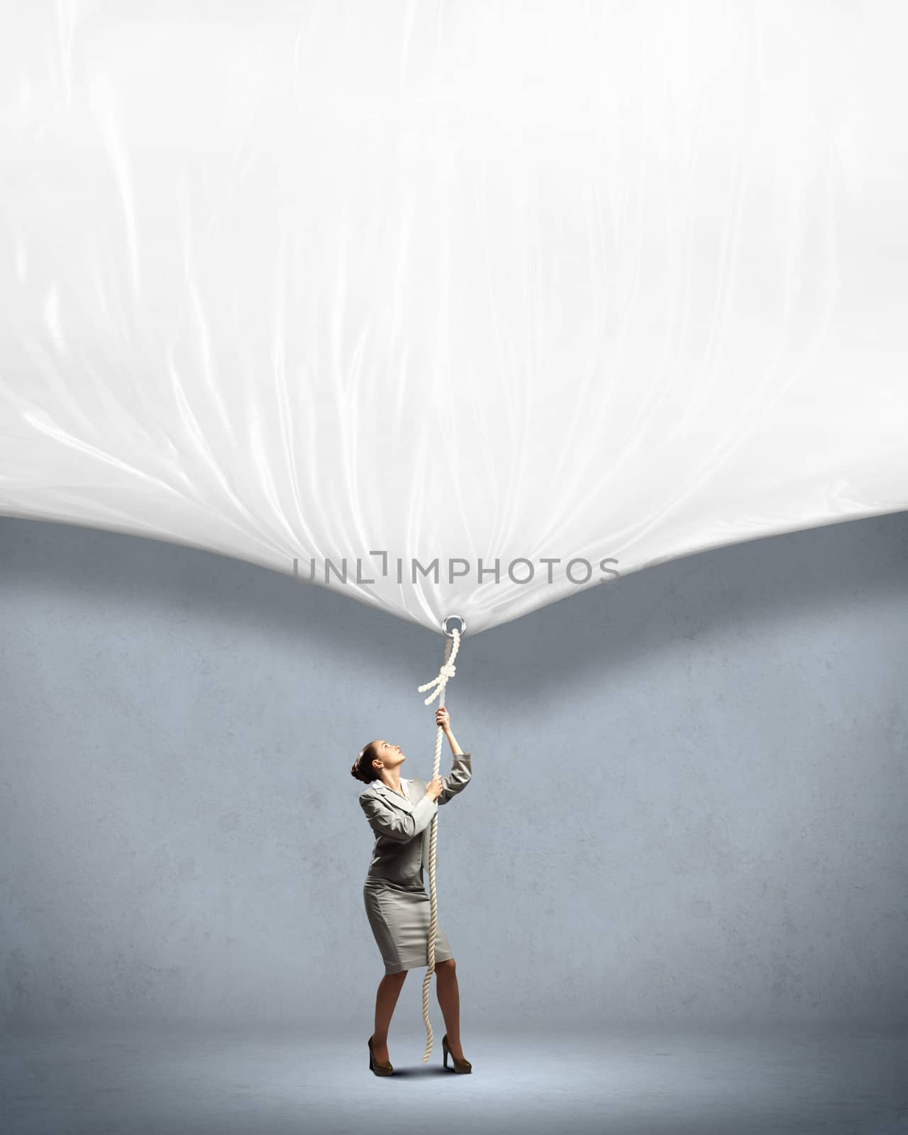 Businesswoman pulling banner by sergey_nivens