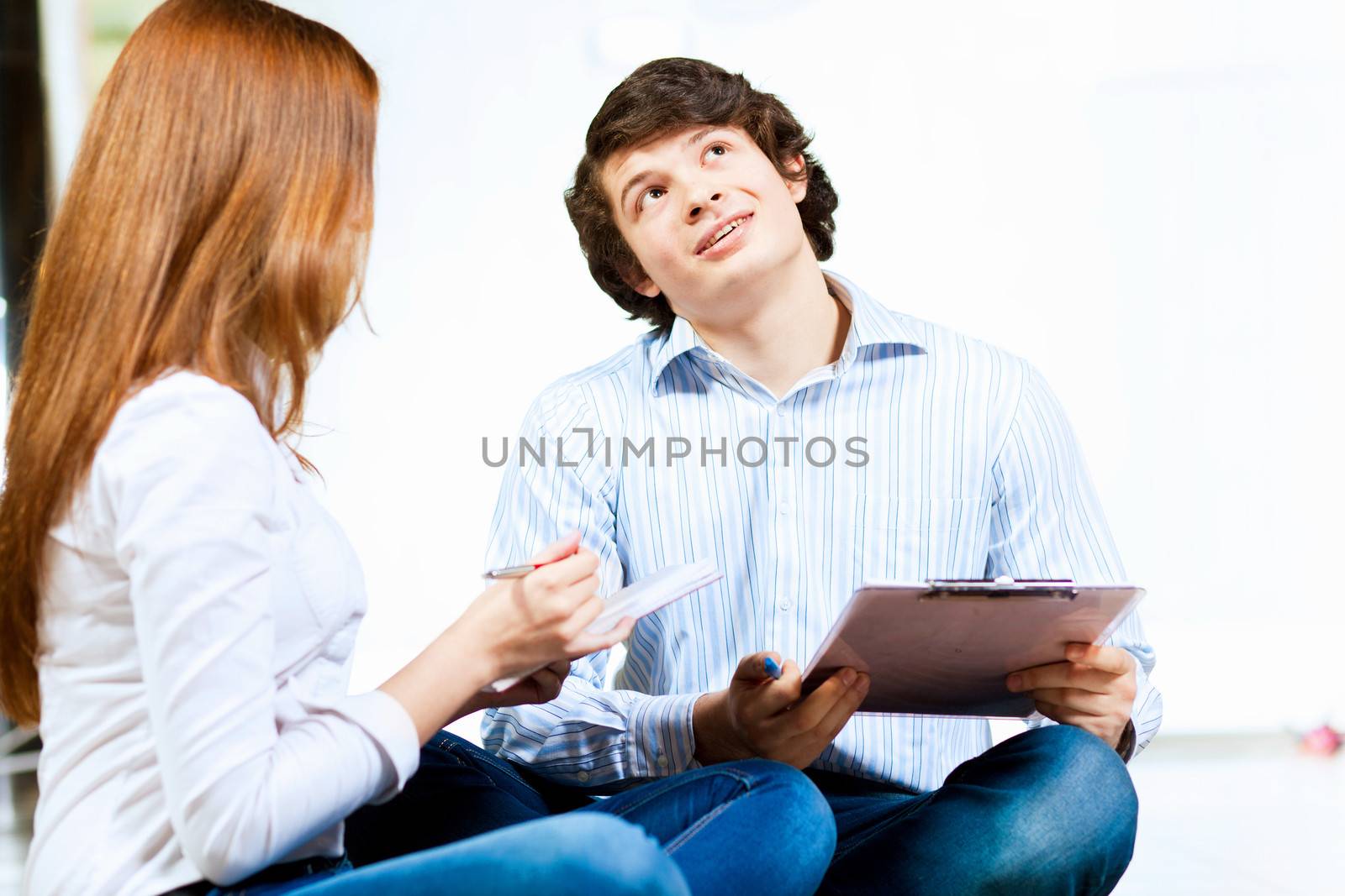Image of two students discussing their work