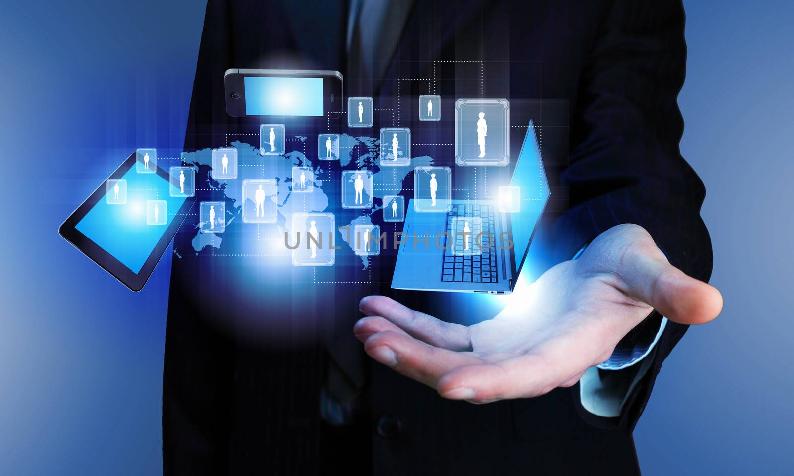 Image of business person holding devices in hands