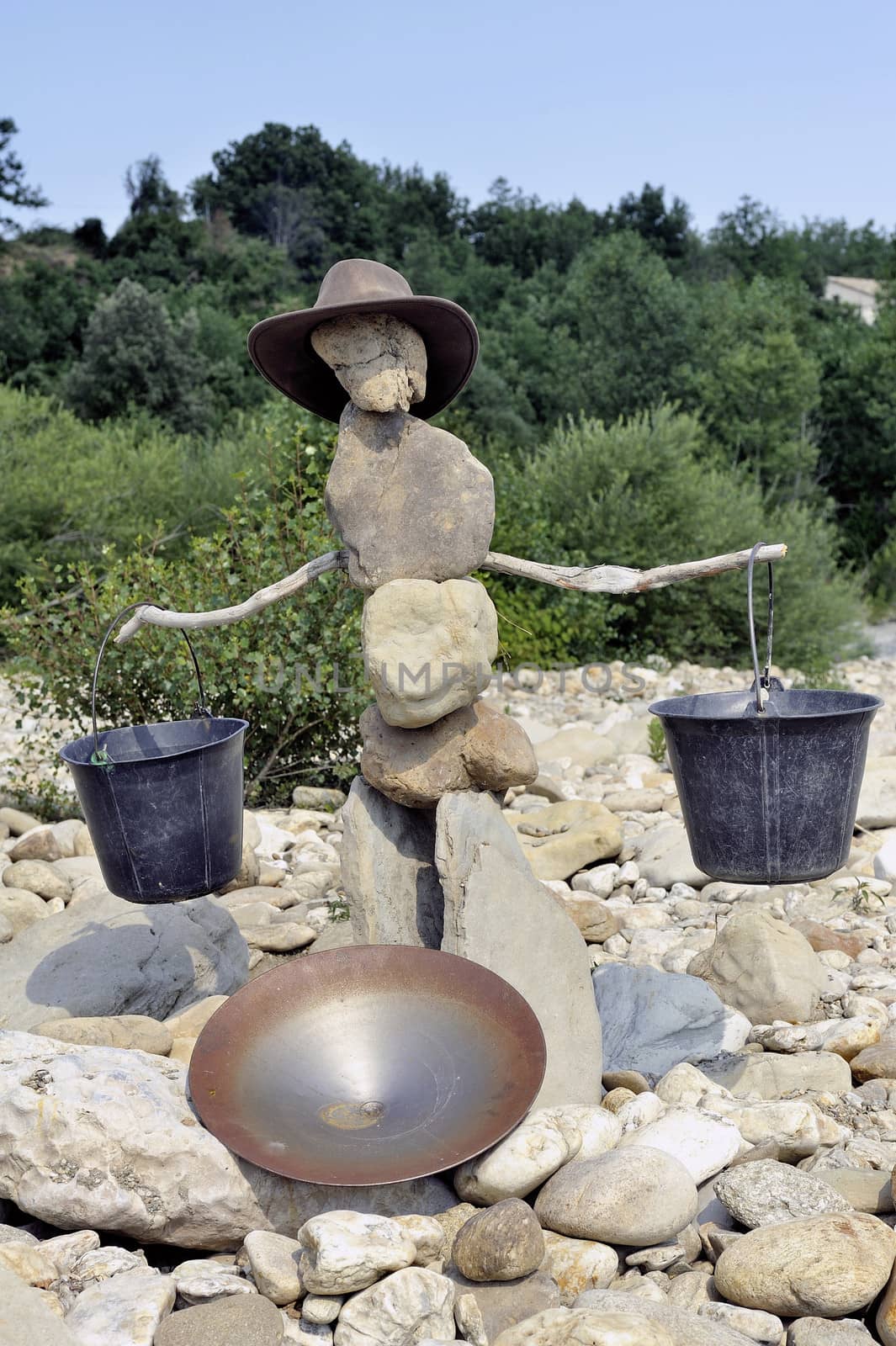 gold washer made of stones in balance