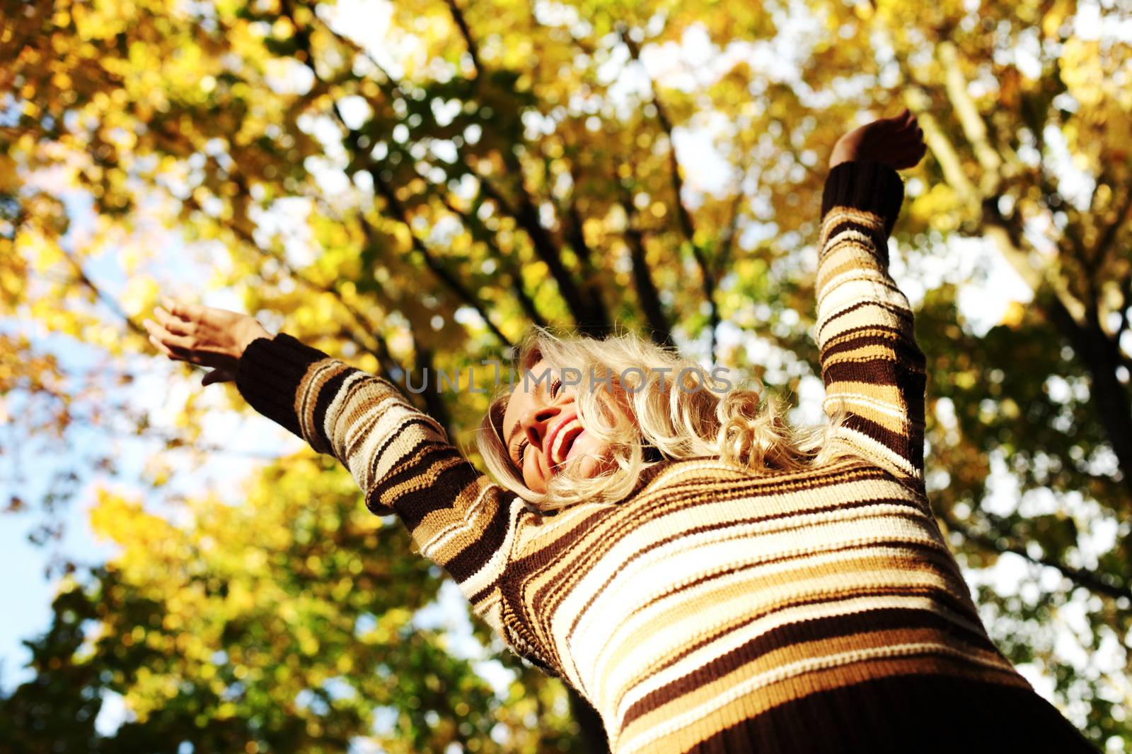 autumn woman hands in the air