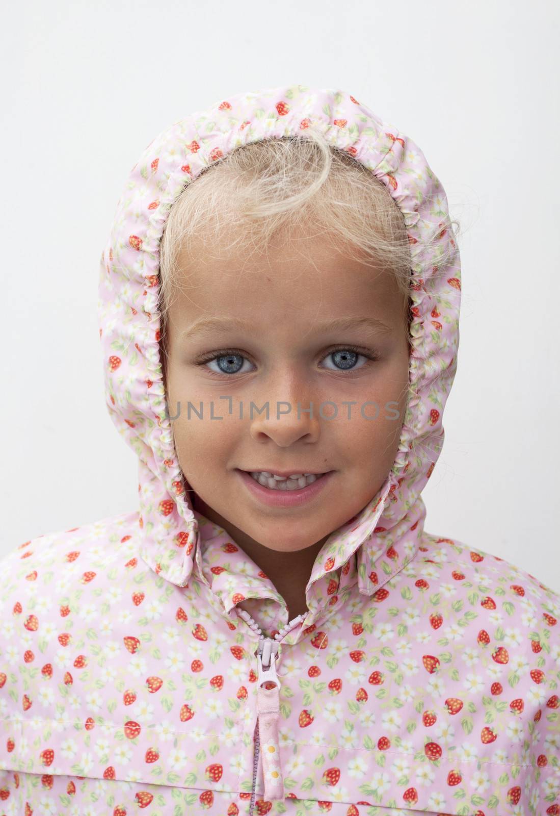 Child with rain coat with hood isolated on white