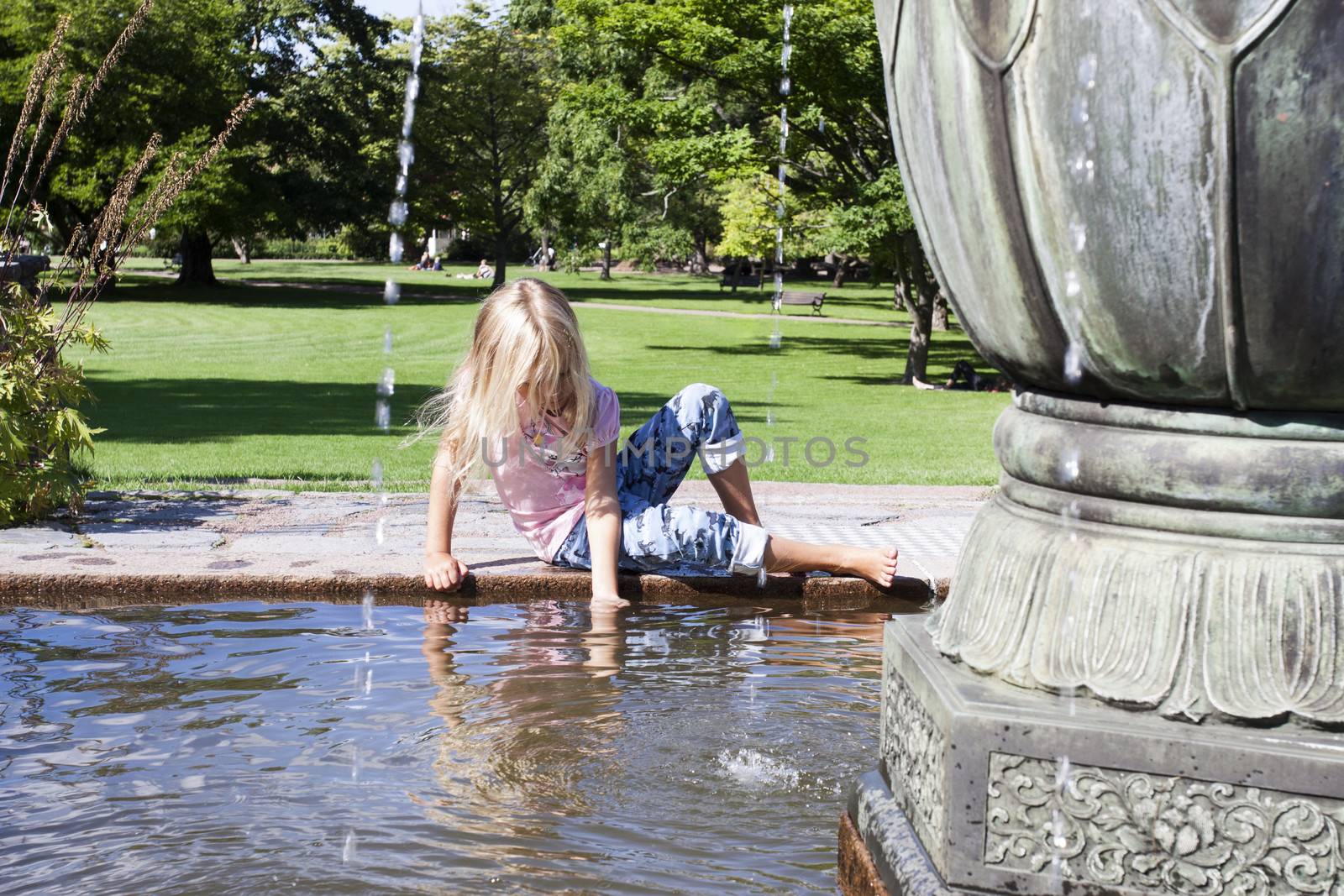 Child and fountain by annems