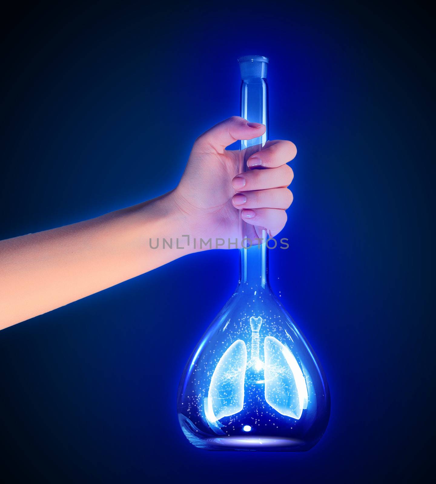 Human hand holding test tube with lungs