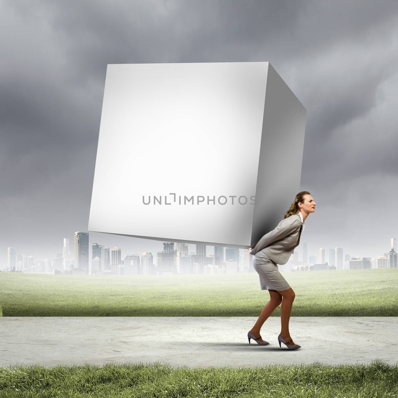 Image of businesswoman carrying big white cube on her back. Place for text