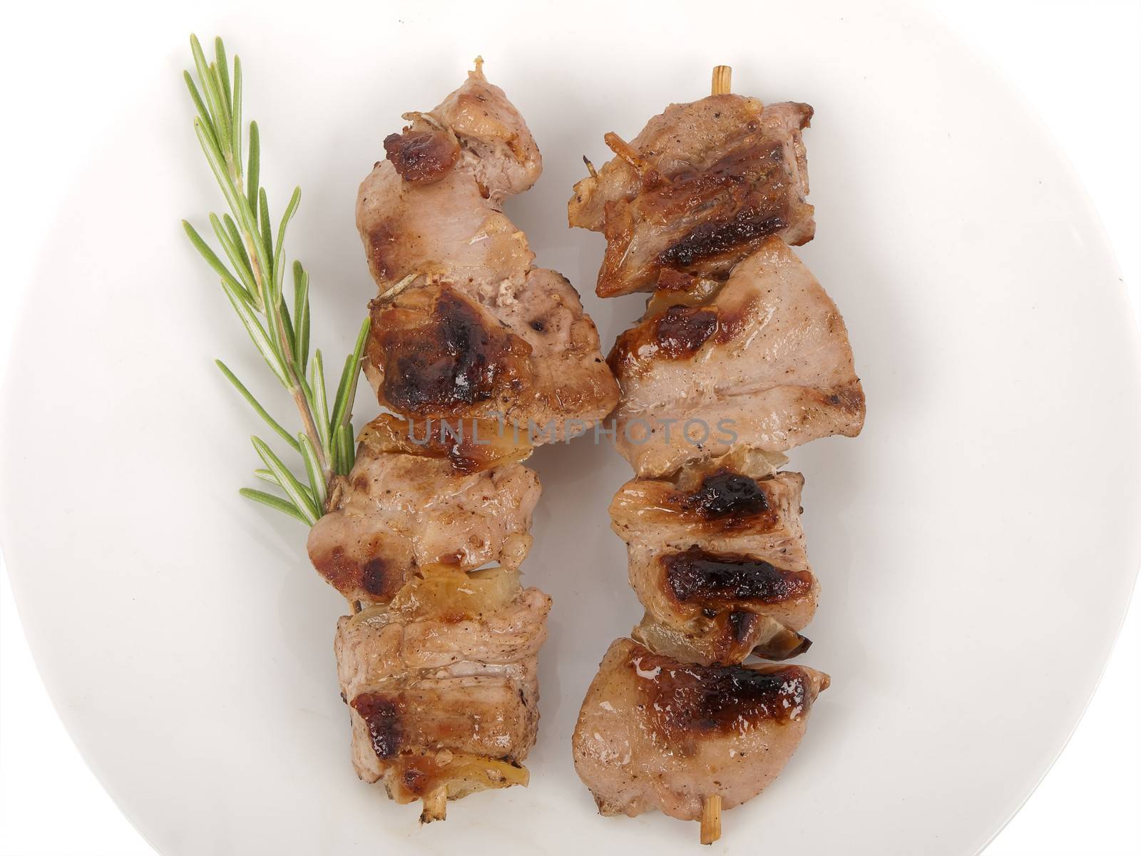 grilled meat on the stick with paprika and rosemary