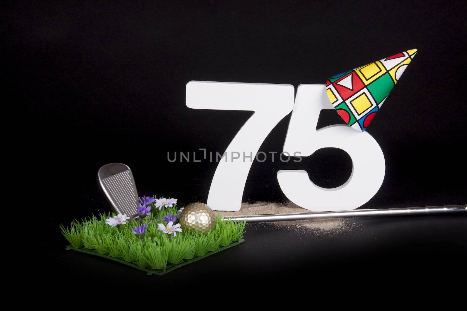 A golf club and golf ball on an artificial peace of grass to be used as a birthday card