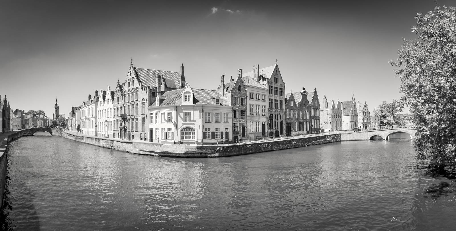 Monochrome panorama view of river canal and houses in Bruges, Belgium